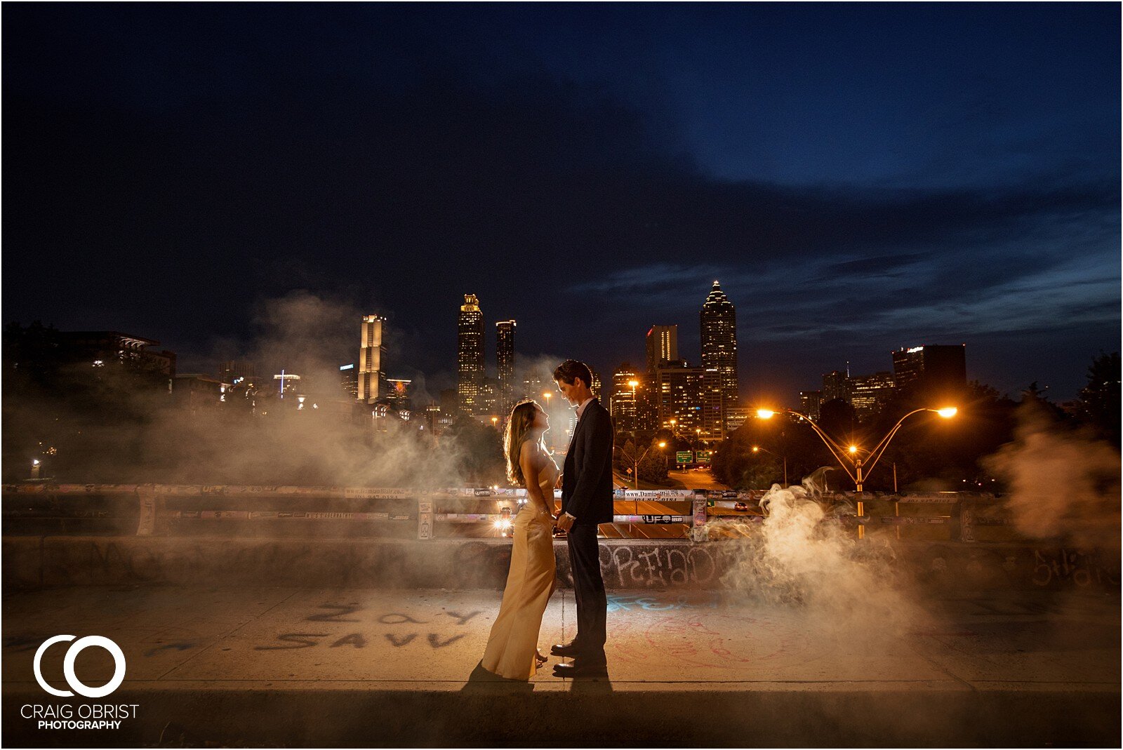 Ponce City Market Jackson Street Bridge Atlanta Skyline Engagement Portraits_0045.jpg