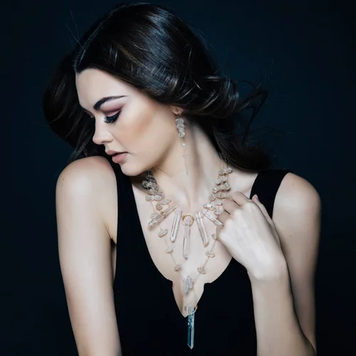 A model wearing two Andrea Li statement necklaces together