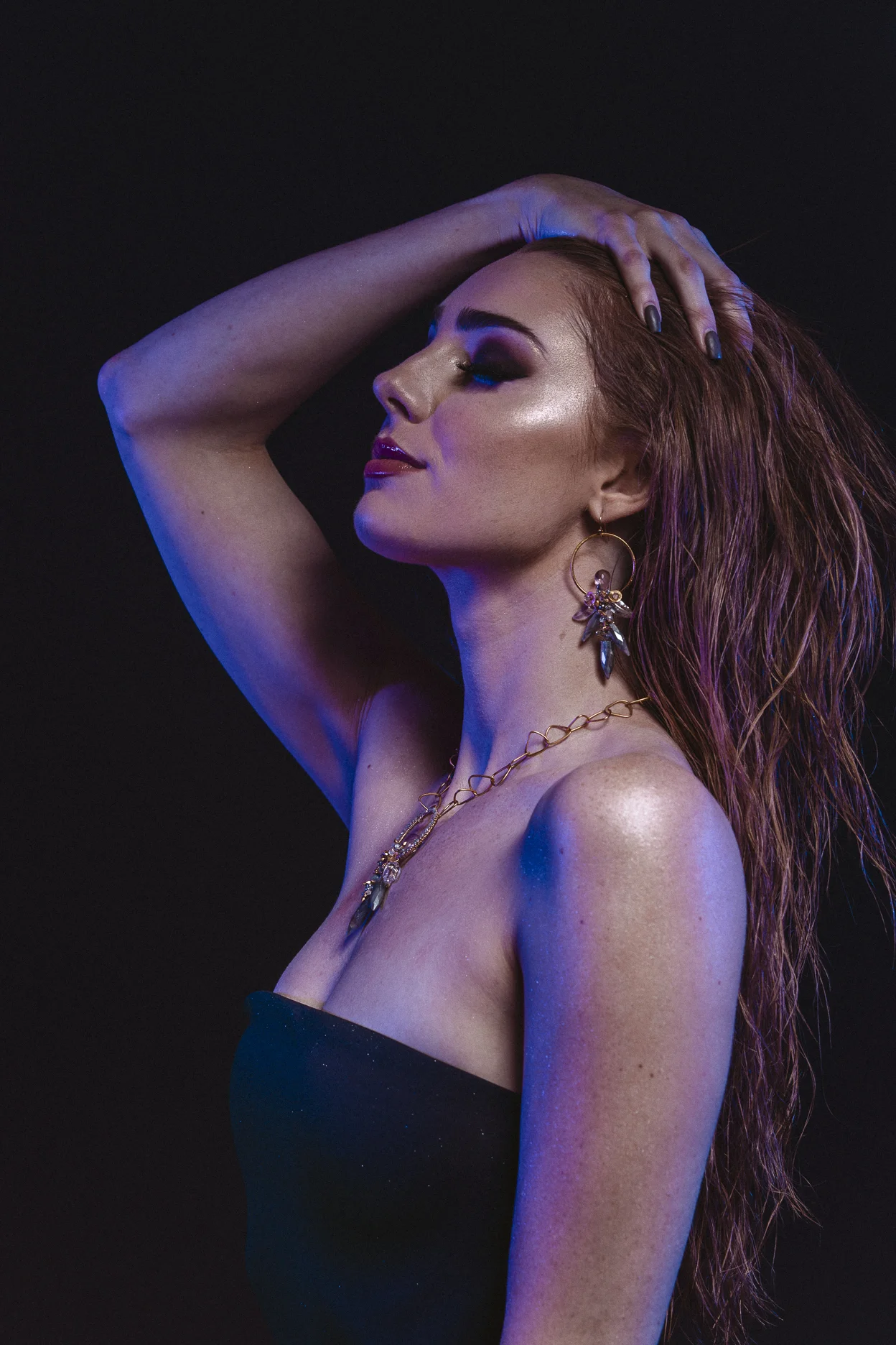 model wearing gemstone hoop earrings