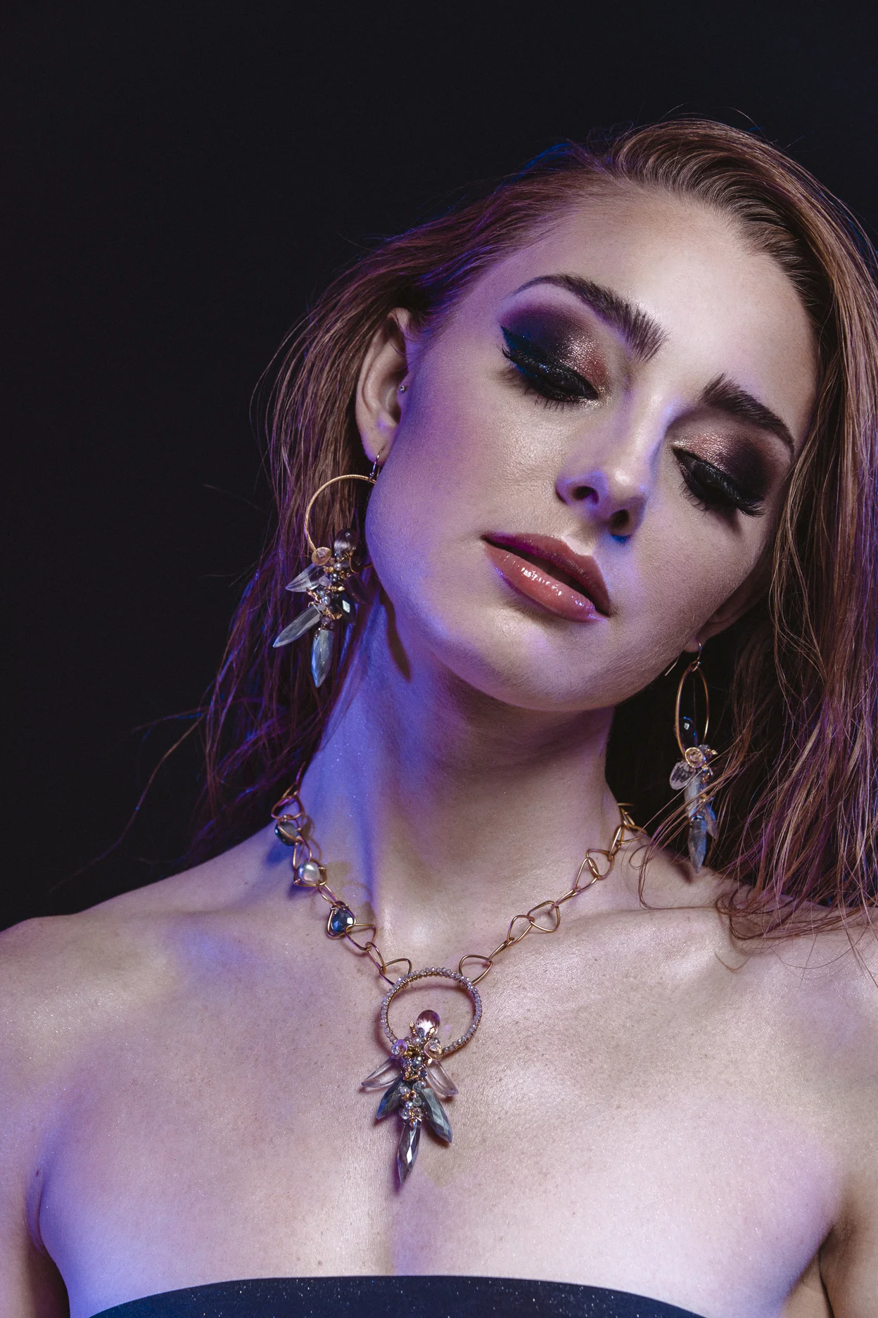 model wearing gemstone hoop earrings