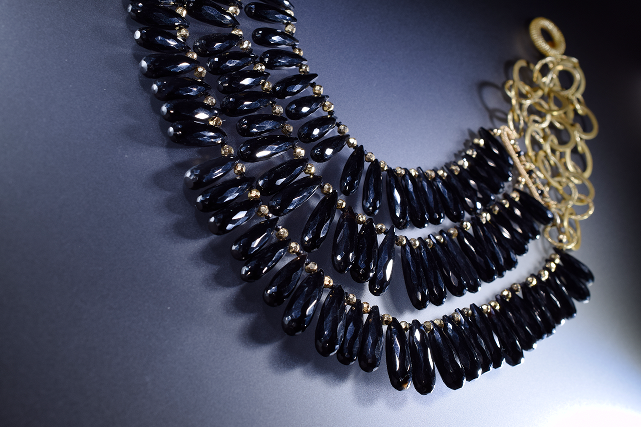 black spinel triple strand gold necklace