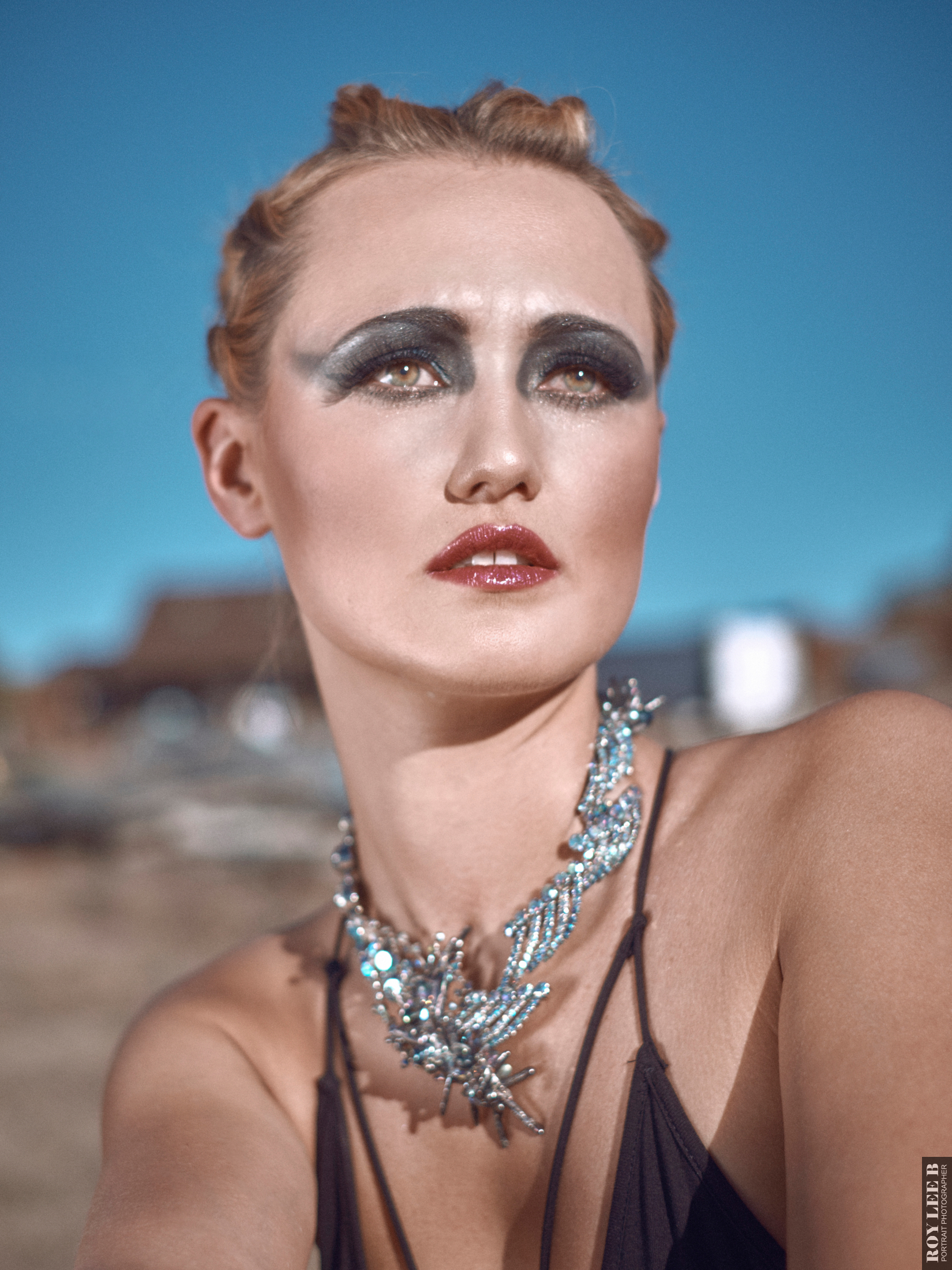 model wearing statement necklace