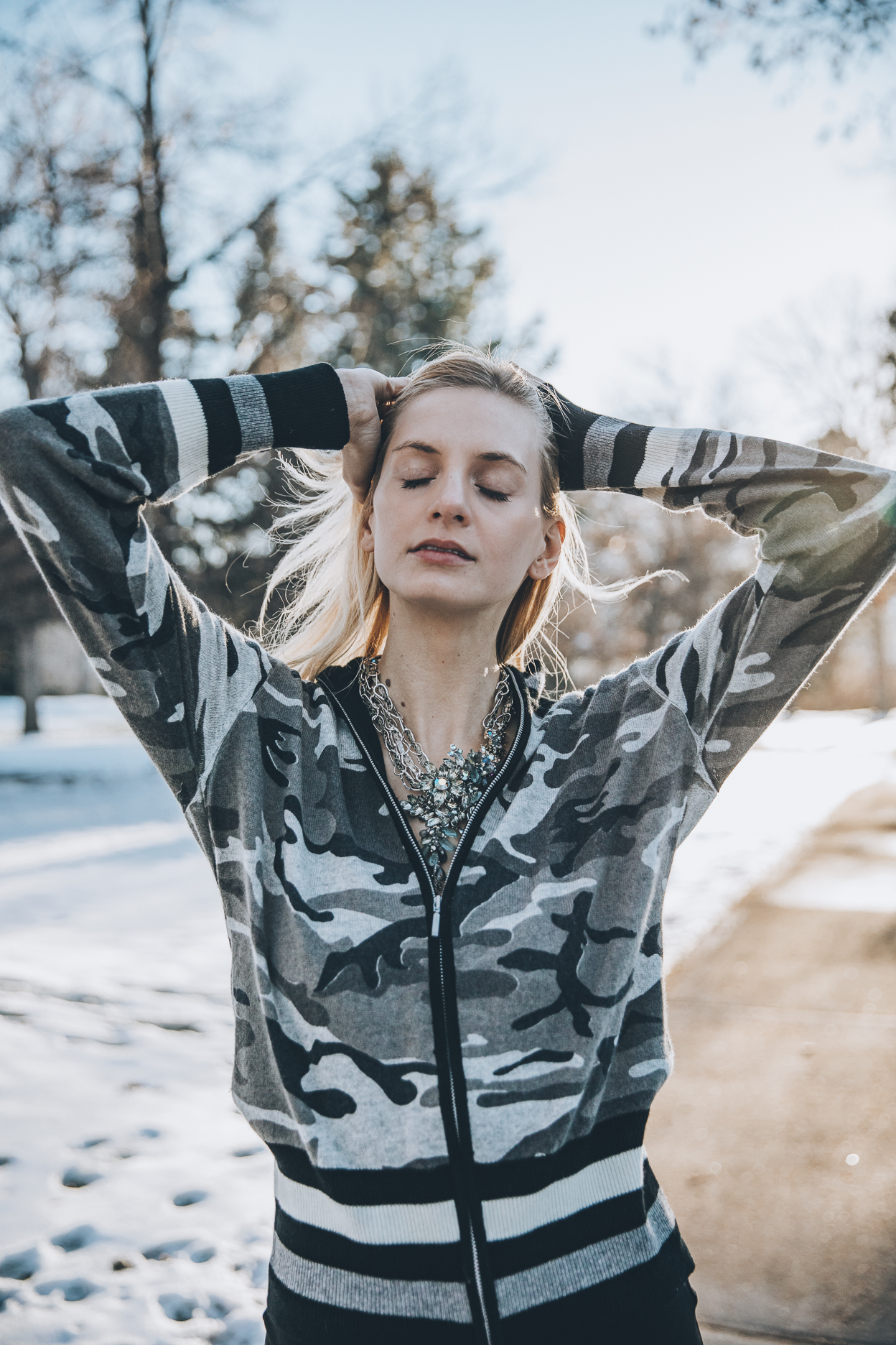 Model wearing statement vintage necklace