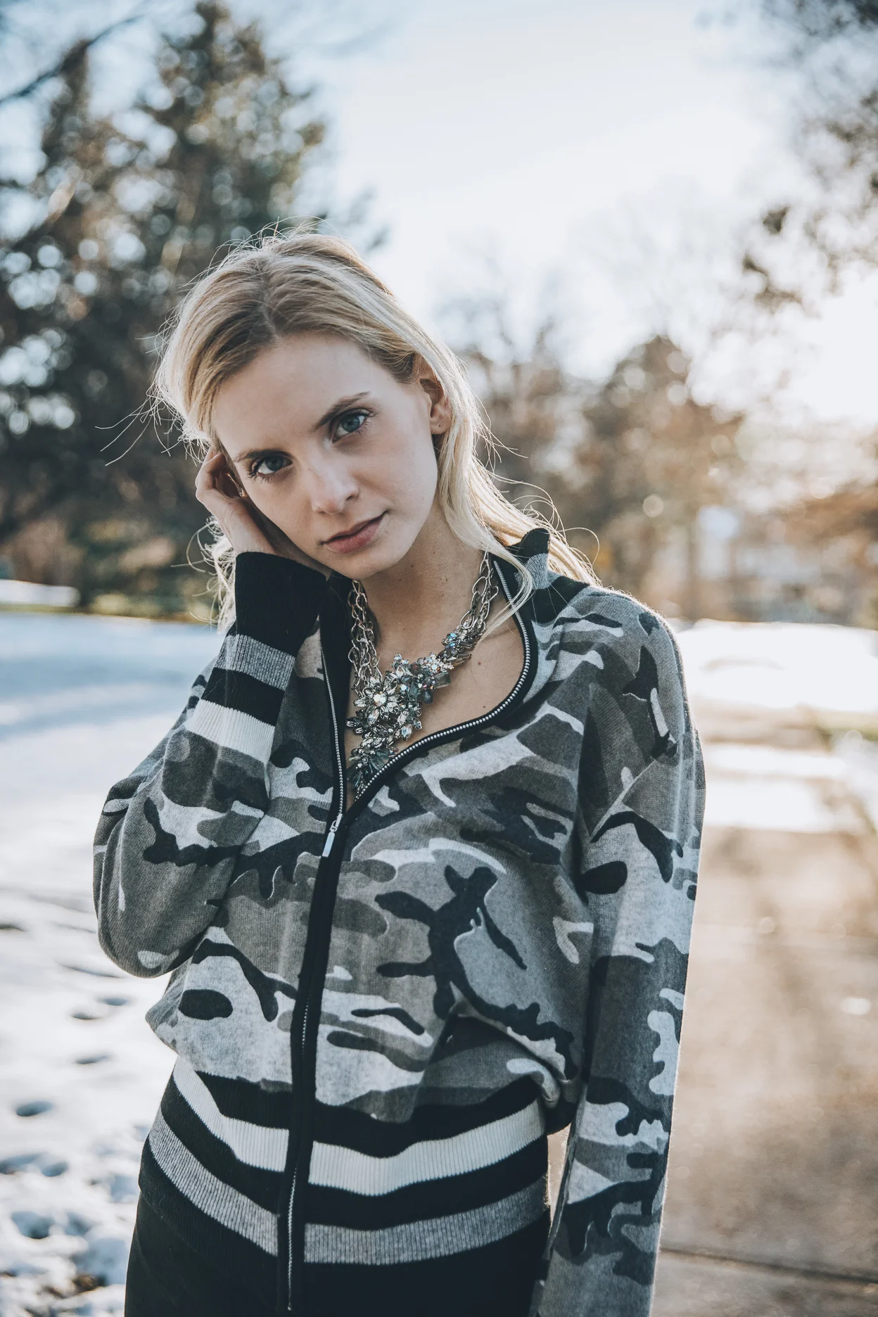 Model wearing statement vintage necklace