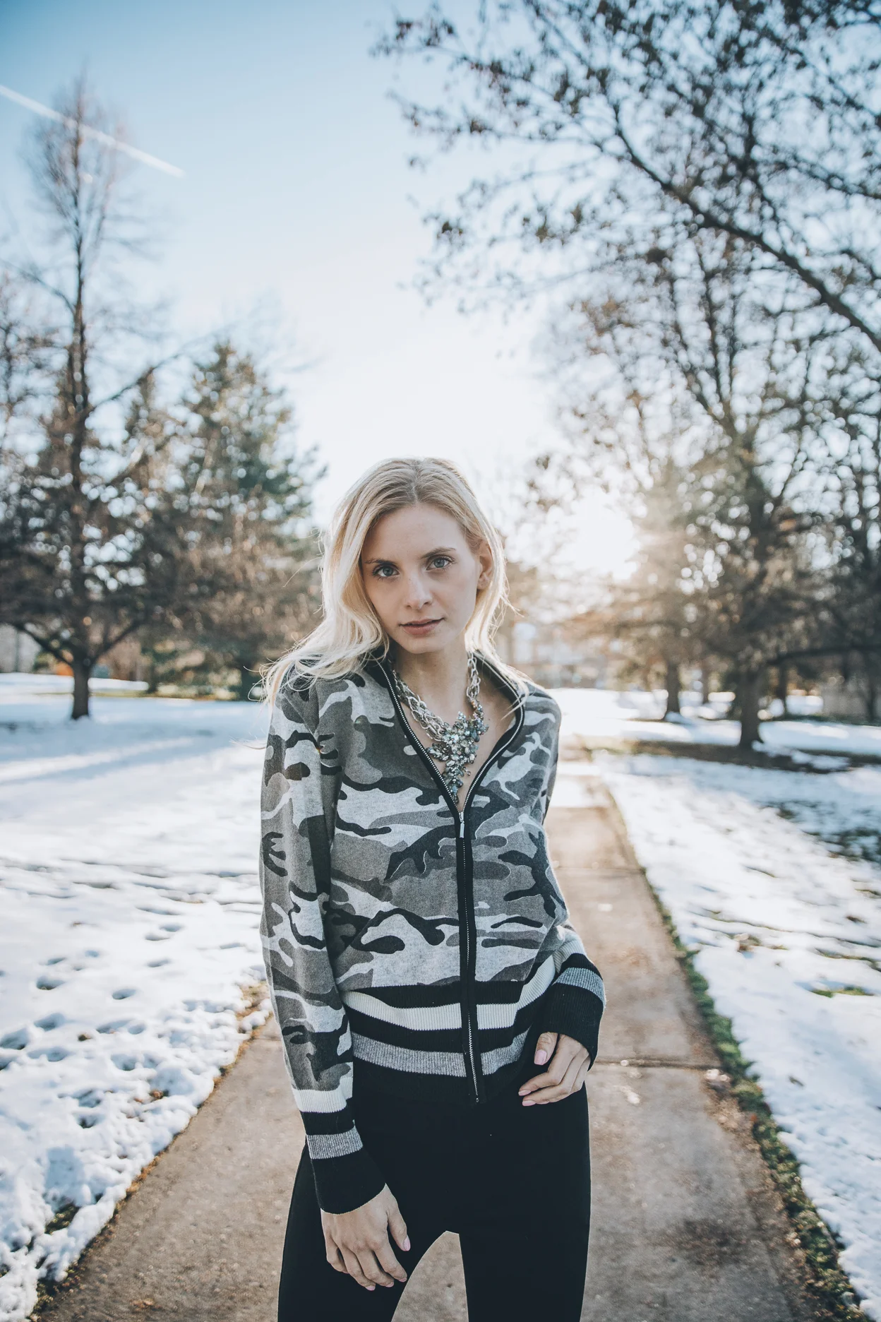Model wearing statement vintage necklace