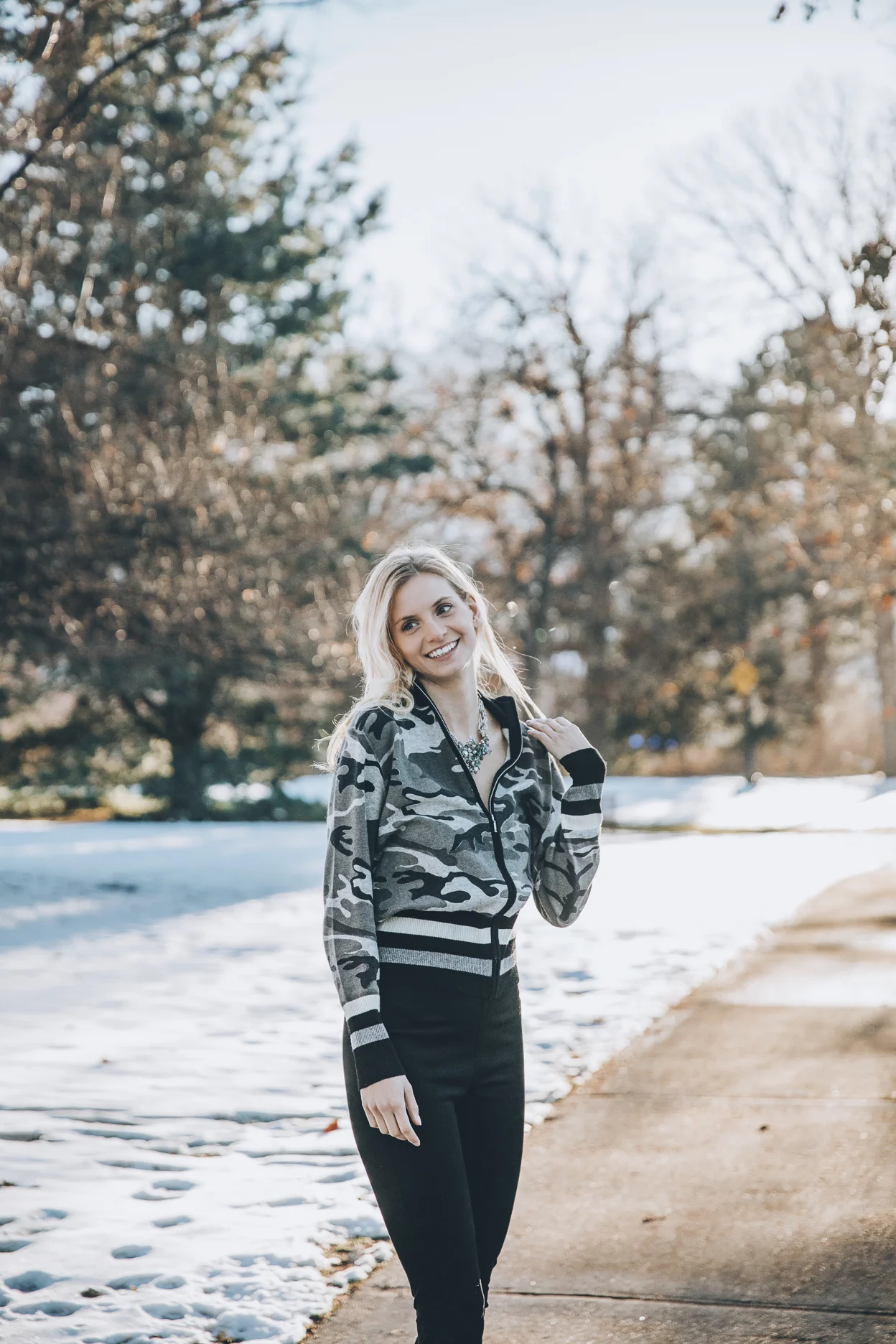 Model wearing statement vintage necklace