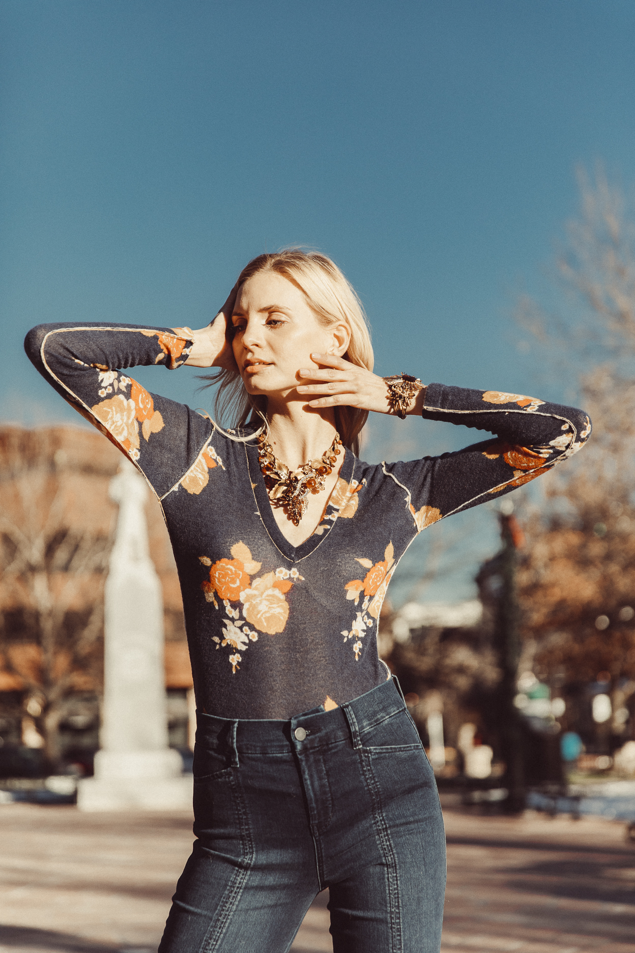 Model wearing gold sunburst vintage cuff bracelet 