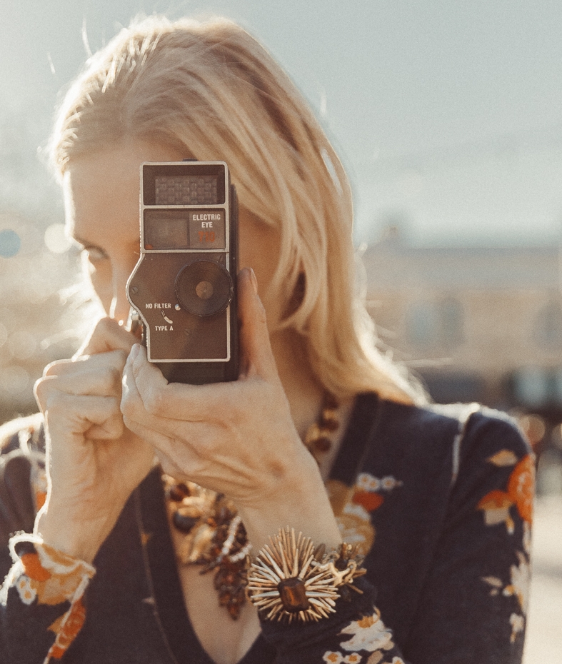 Model wearing gold sunburst vintage cuff bracelet 