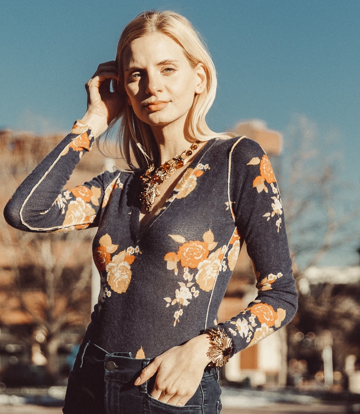 Model wearing gold sunburst vintage cuff bracelet 