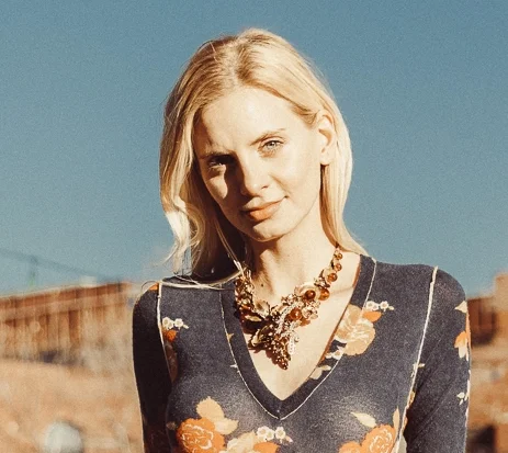 model wearing gold leaf vintage statement necklace and cuff