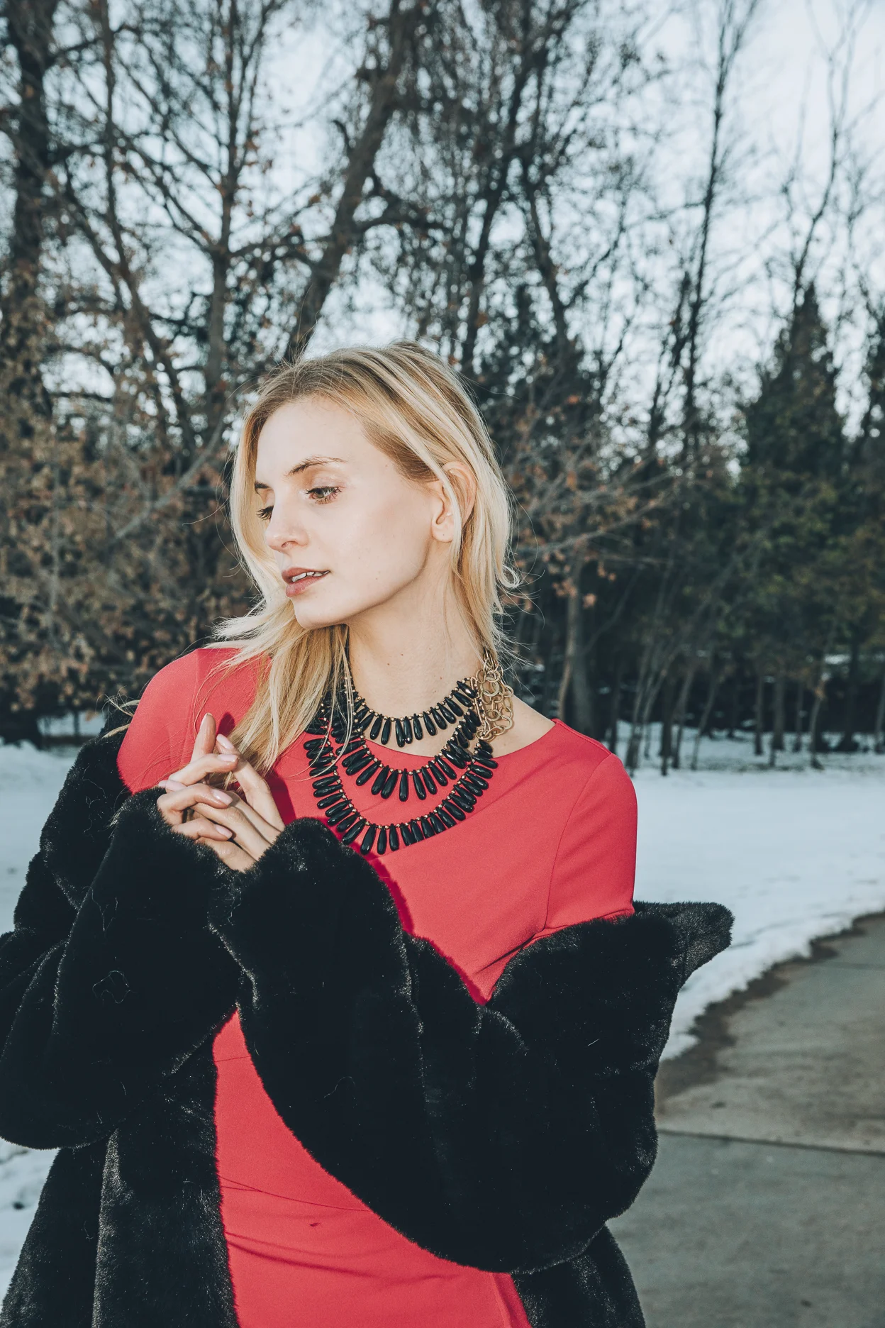 Model wearing a triple strand black spinel collar necklace