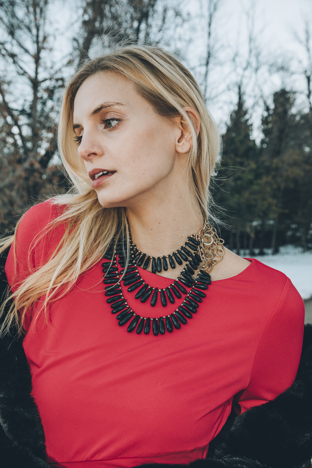 Model wearing a triple strand black spinel collar necklace