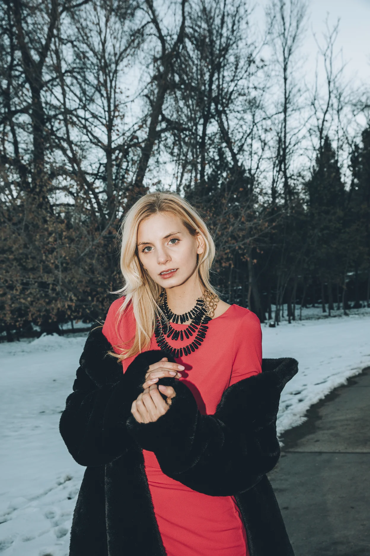 Model wearing a triple strand black spinel collar necklace