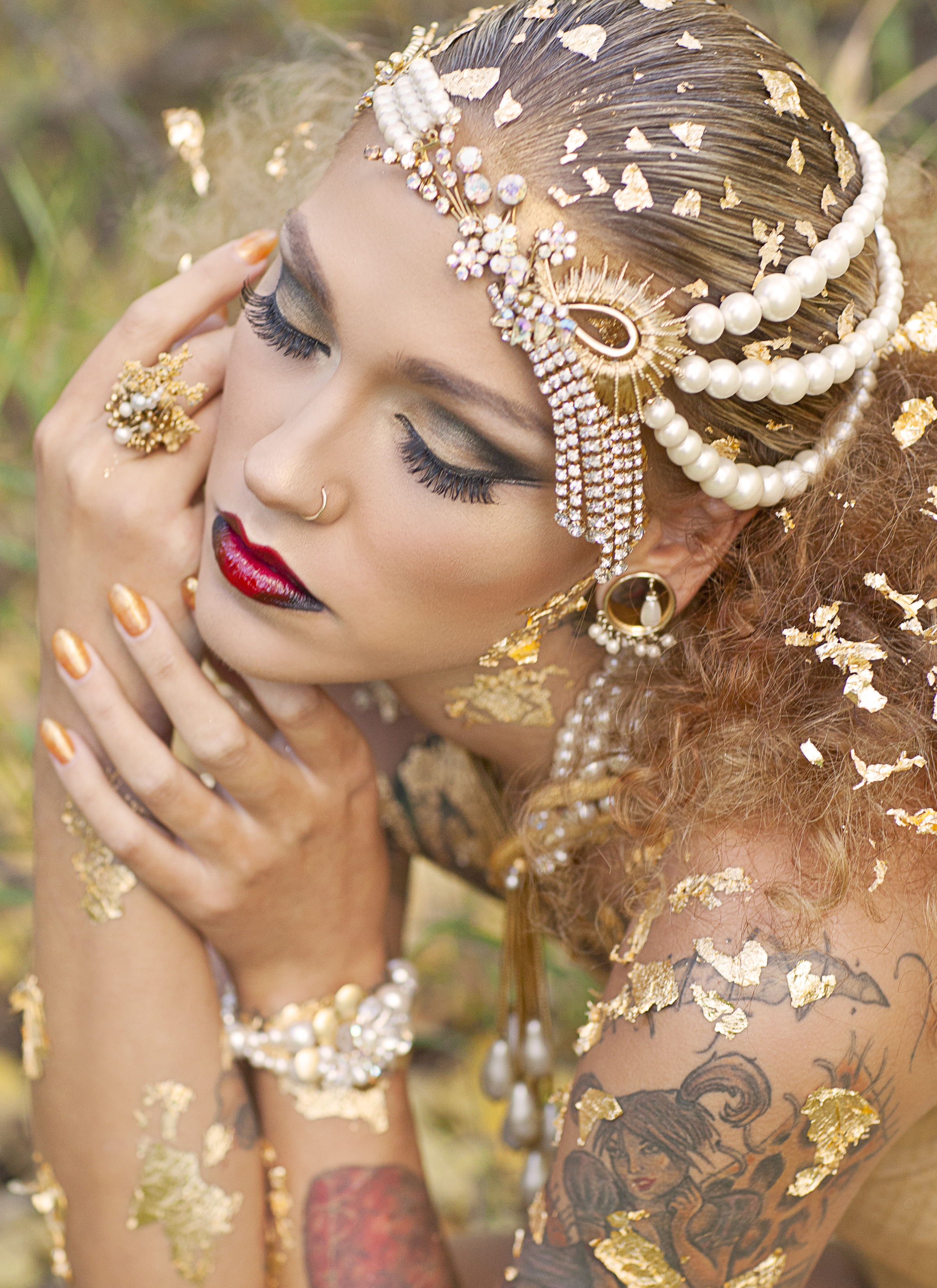 model wearing triple strand pearl and vintage rhinestone statement necklace