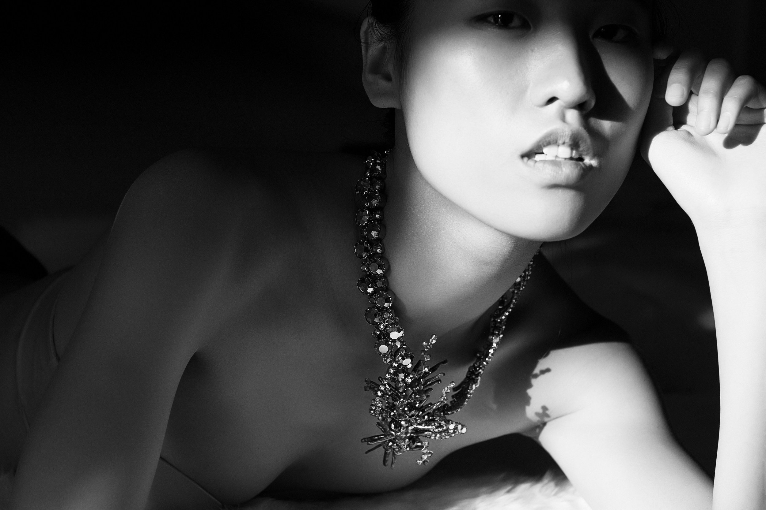 model wearing rhinestone vintage and gemstone statement necklace