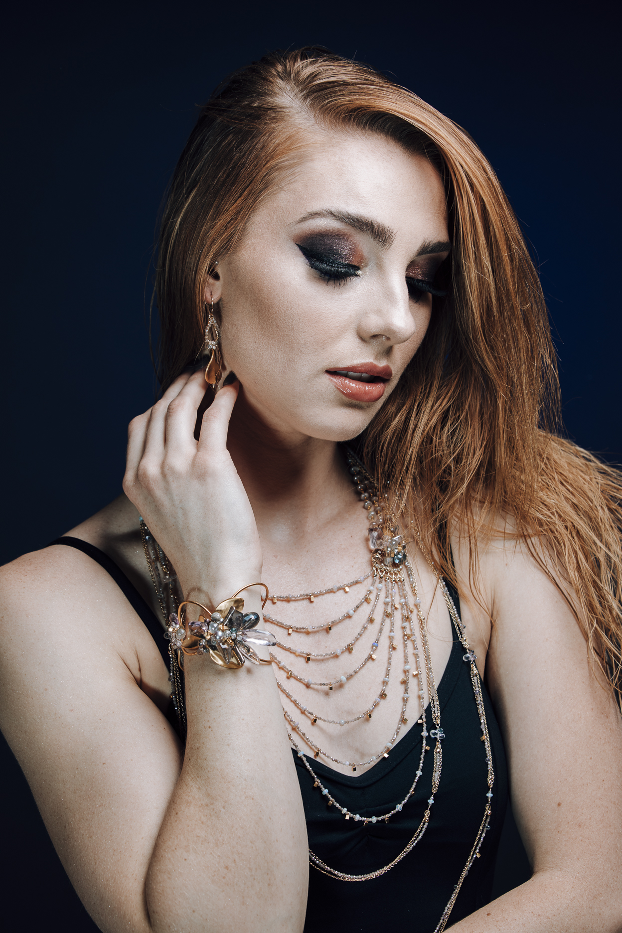 model wearing multi-strand necklacemulti strand gemstone bib statement gold necklace