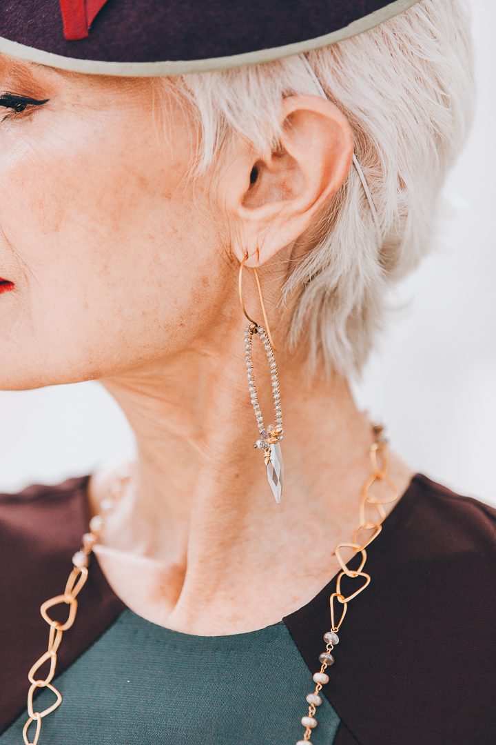 Advanced style blogger Style Crone wearing gemstone earrings