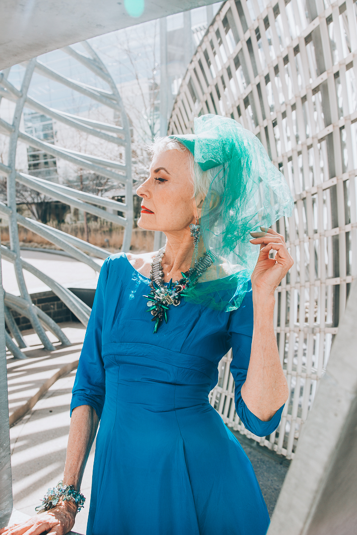 Advanced style blogger Style Crone wearing a statement beetle wing and gemstone necklace 