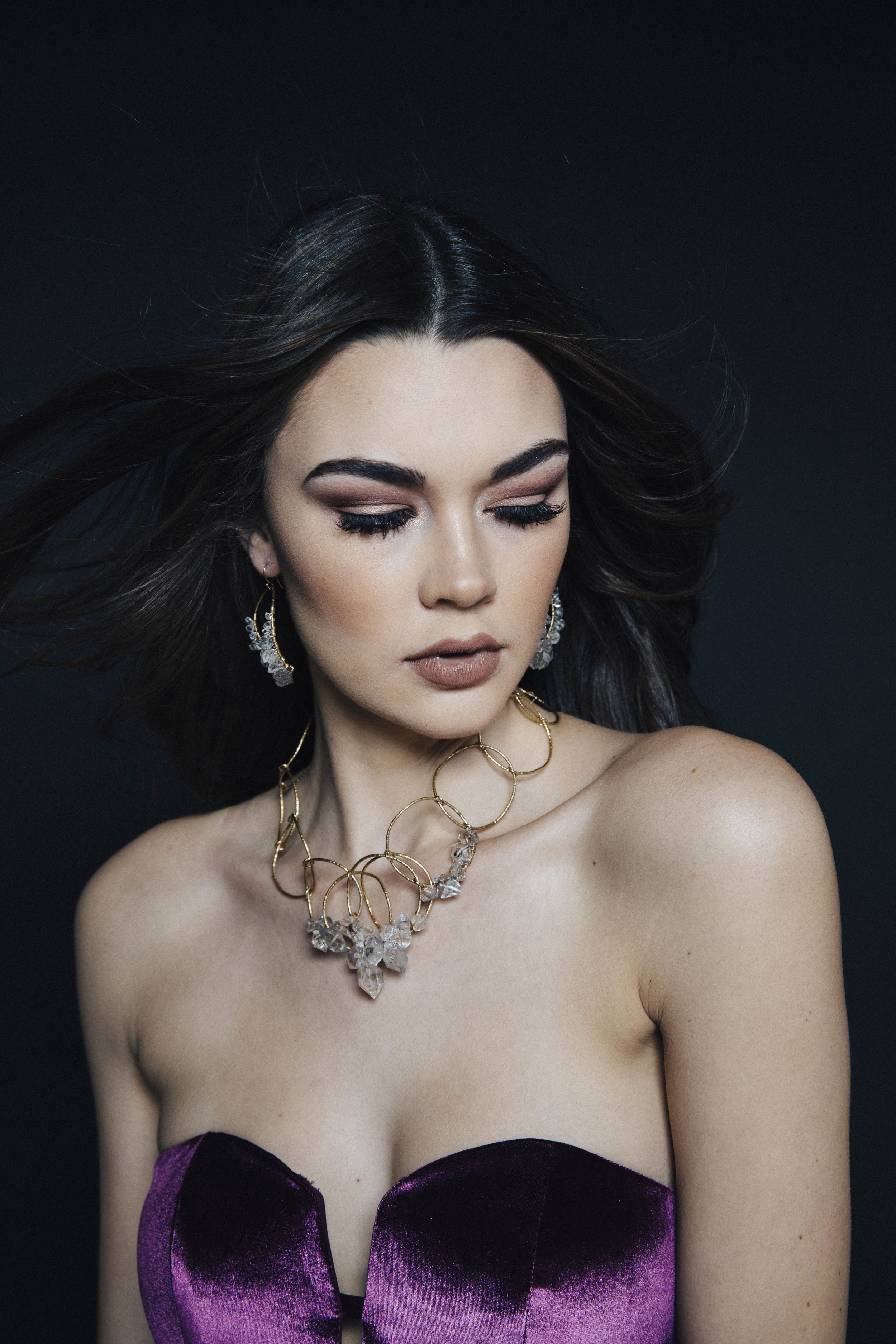 Model wearing a statement herkimer diamond and crystal collar