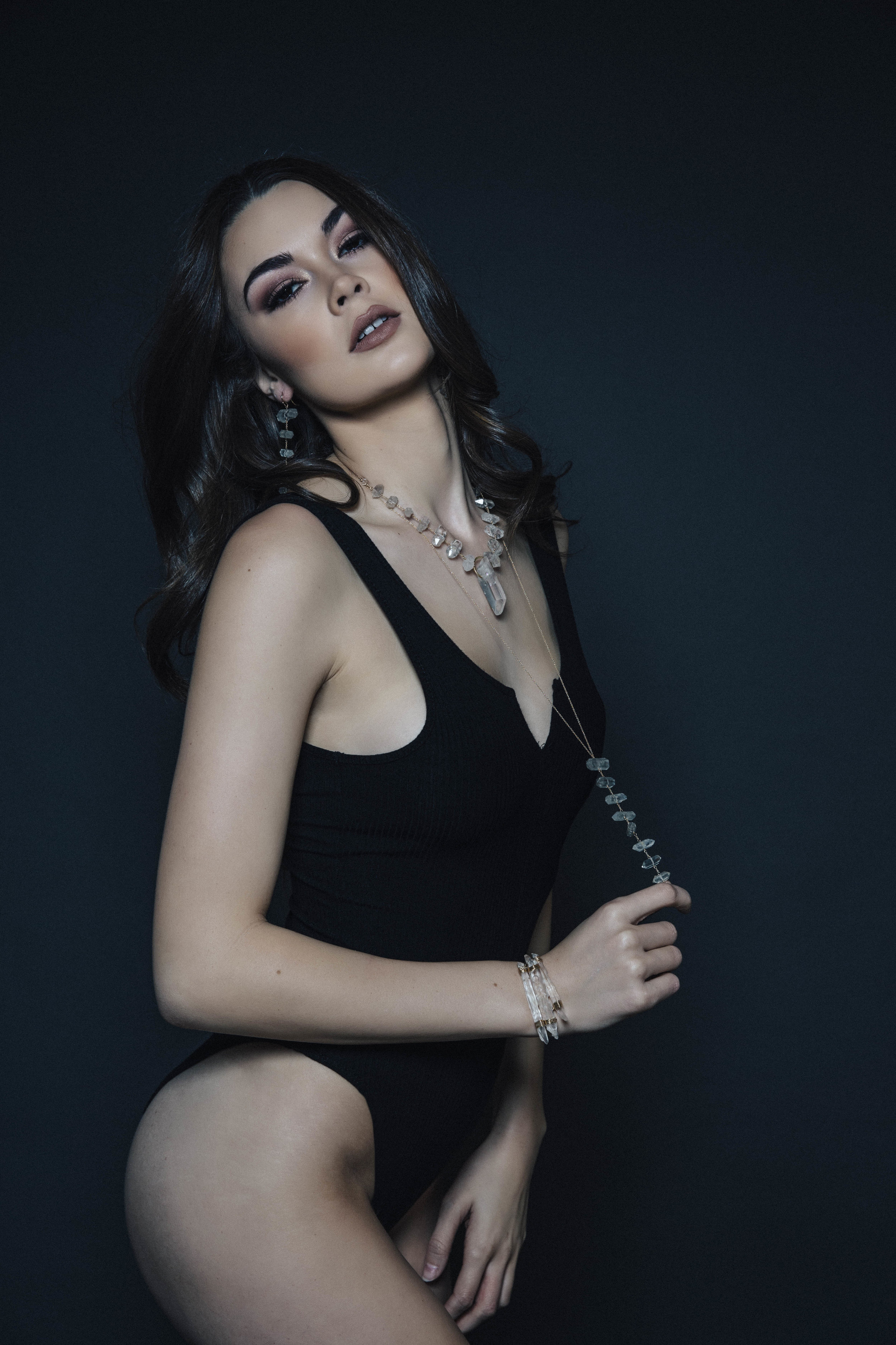 Model wearing tiered rock crystal long necklace