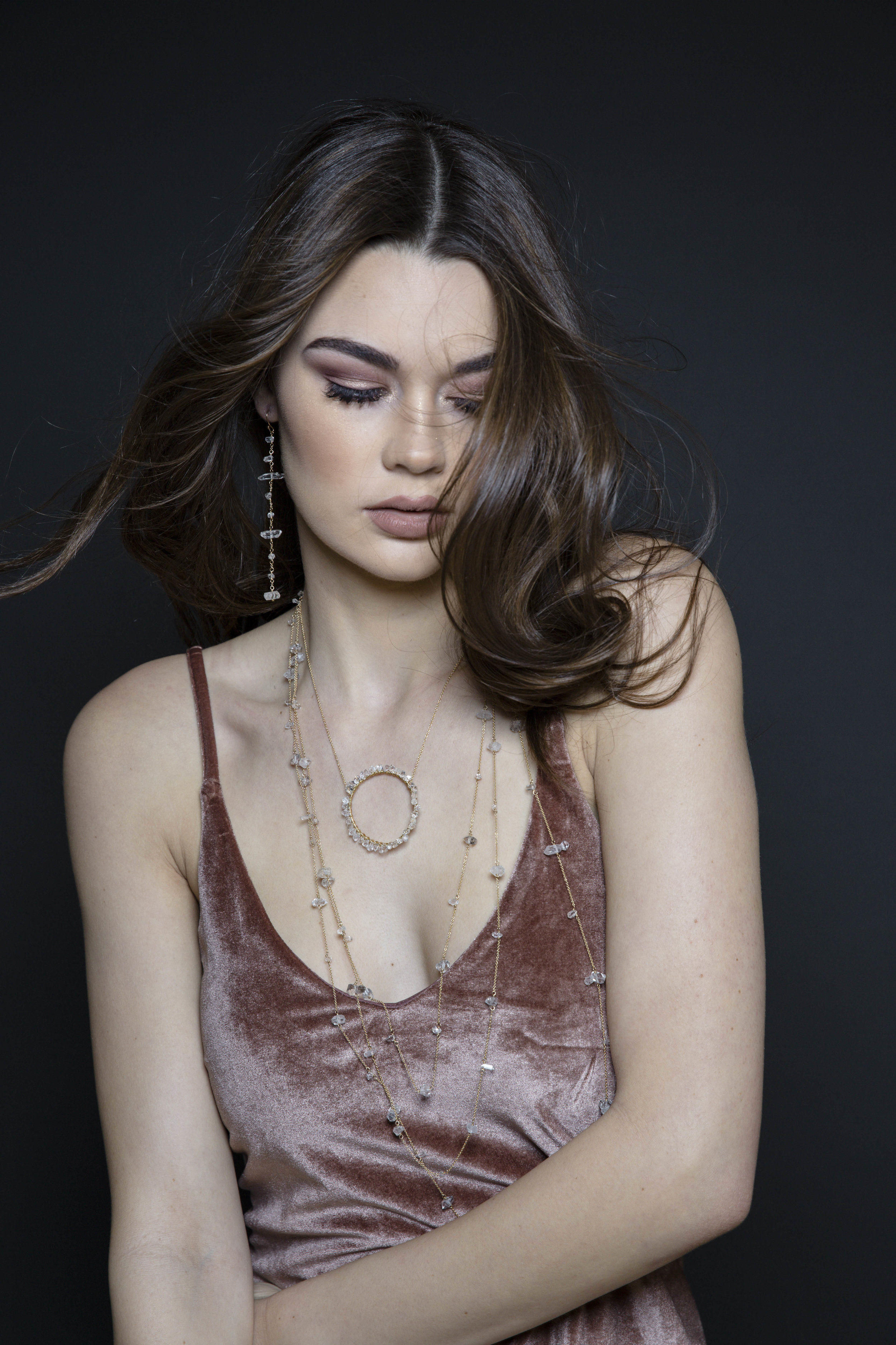 Model wearing long herkimer diamond earrings