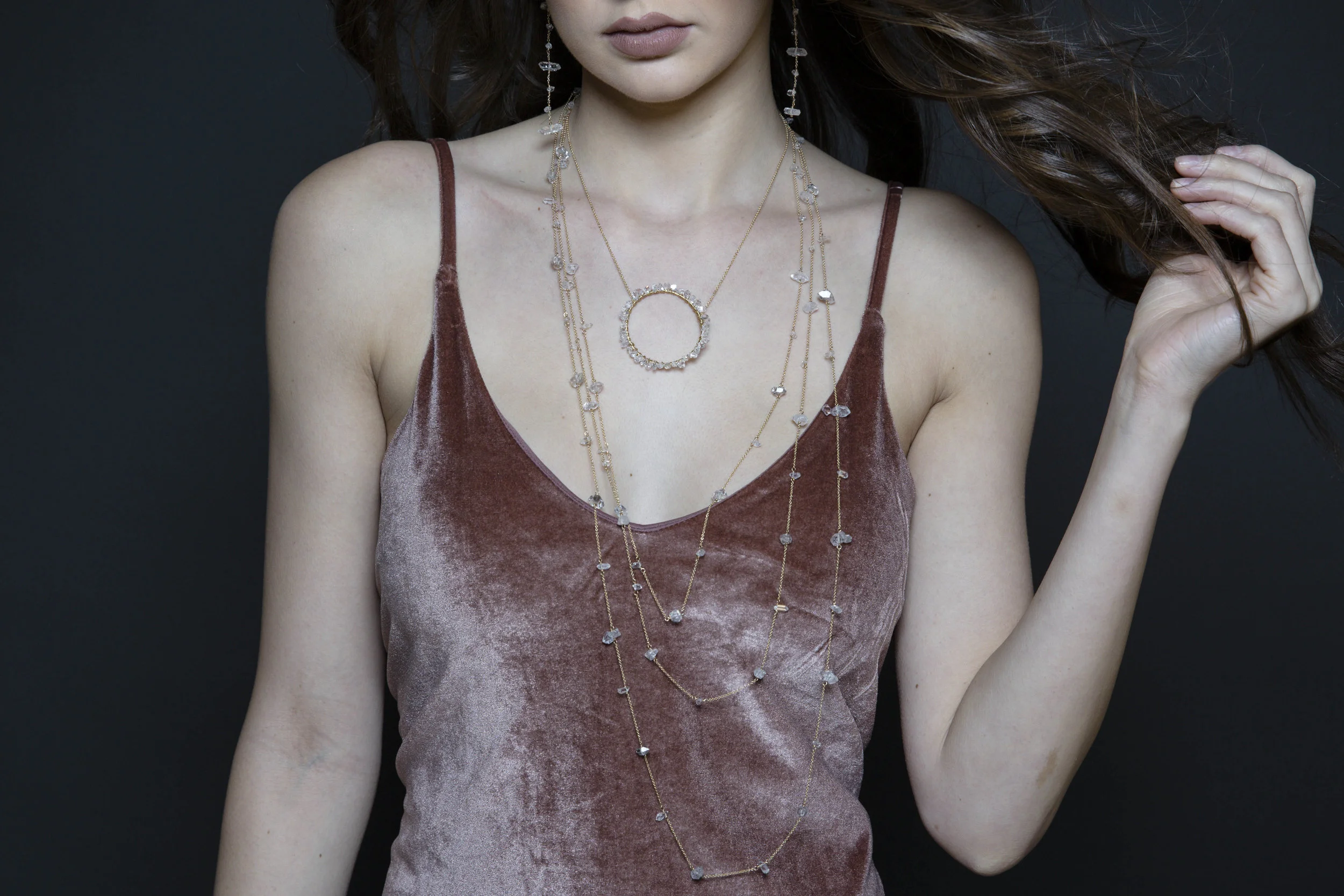 Model wearing herkimer diamond encrusted pendant necklace