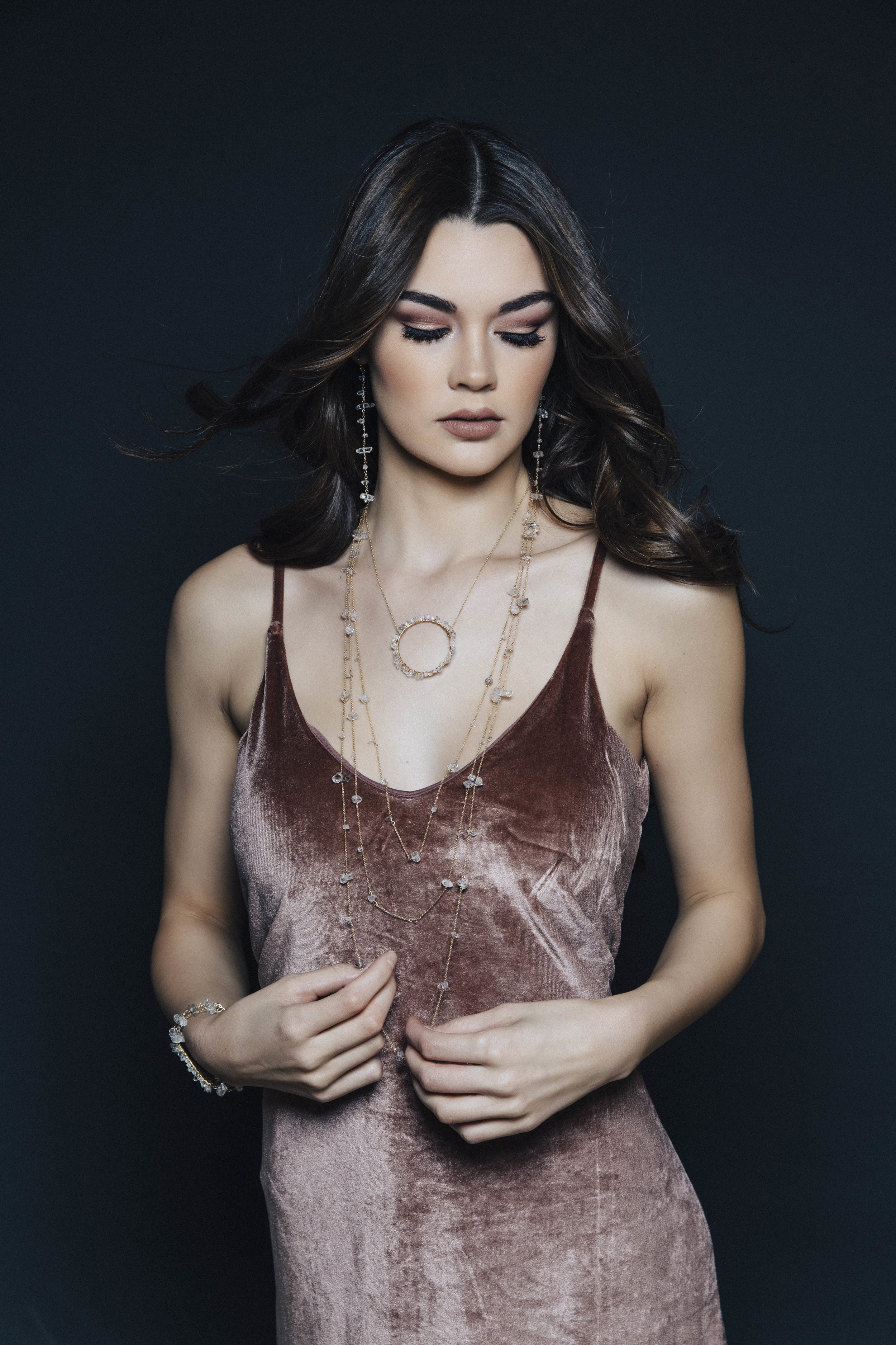 Model wearing herkimer diamond encrusted pendant necklace