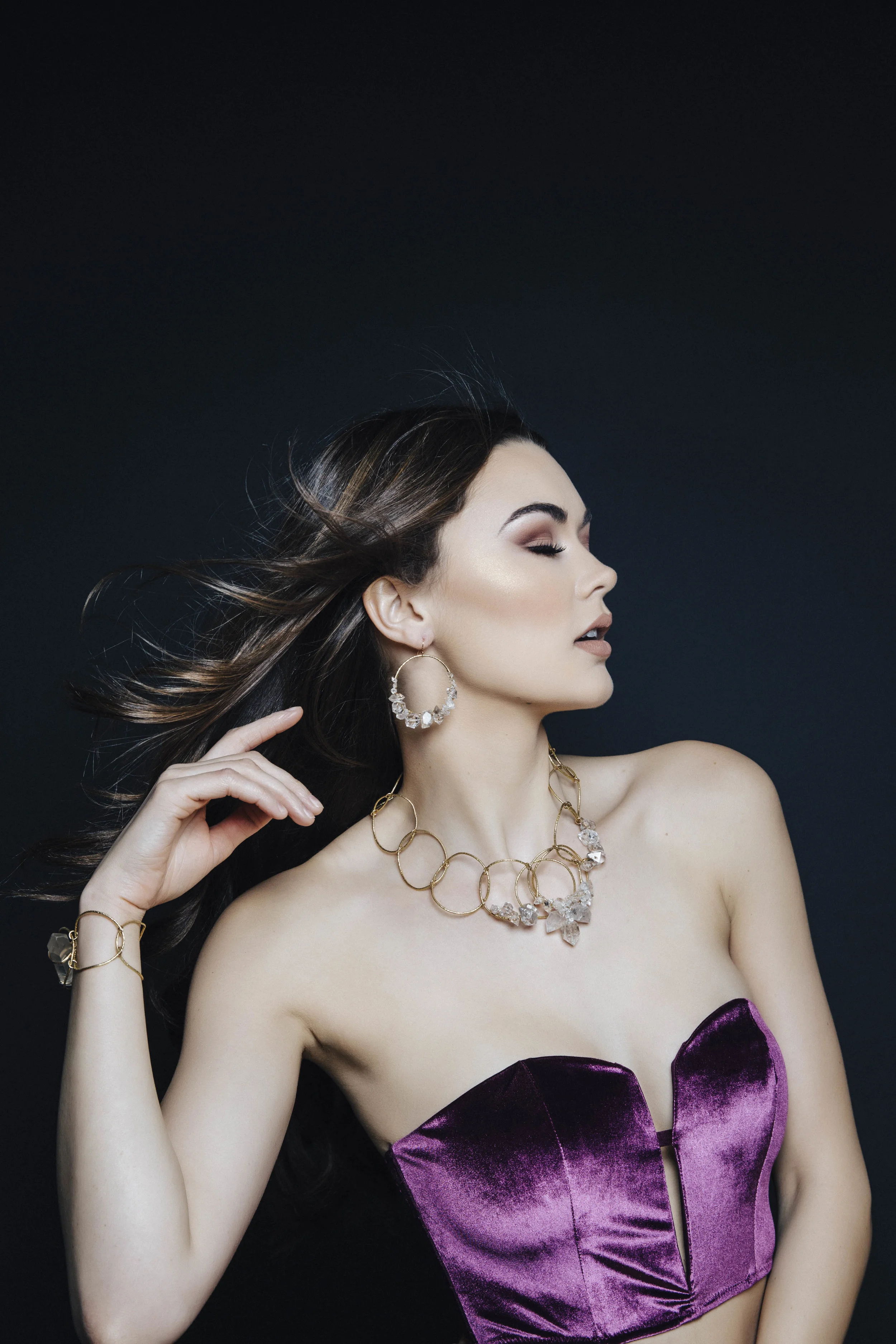 model wearing herkimer diamond encrusted gold hoops