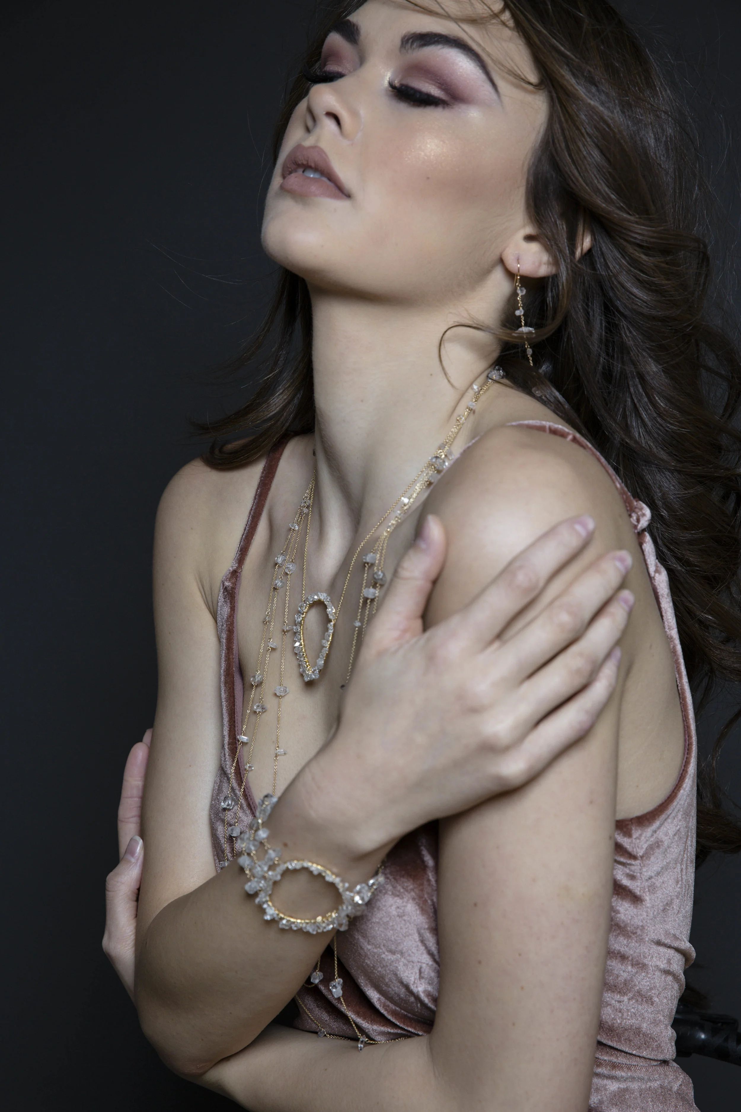 model wearing a triple strand herkimer diamond circle encrusted cuff bracelet 