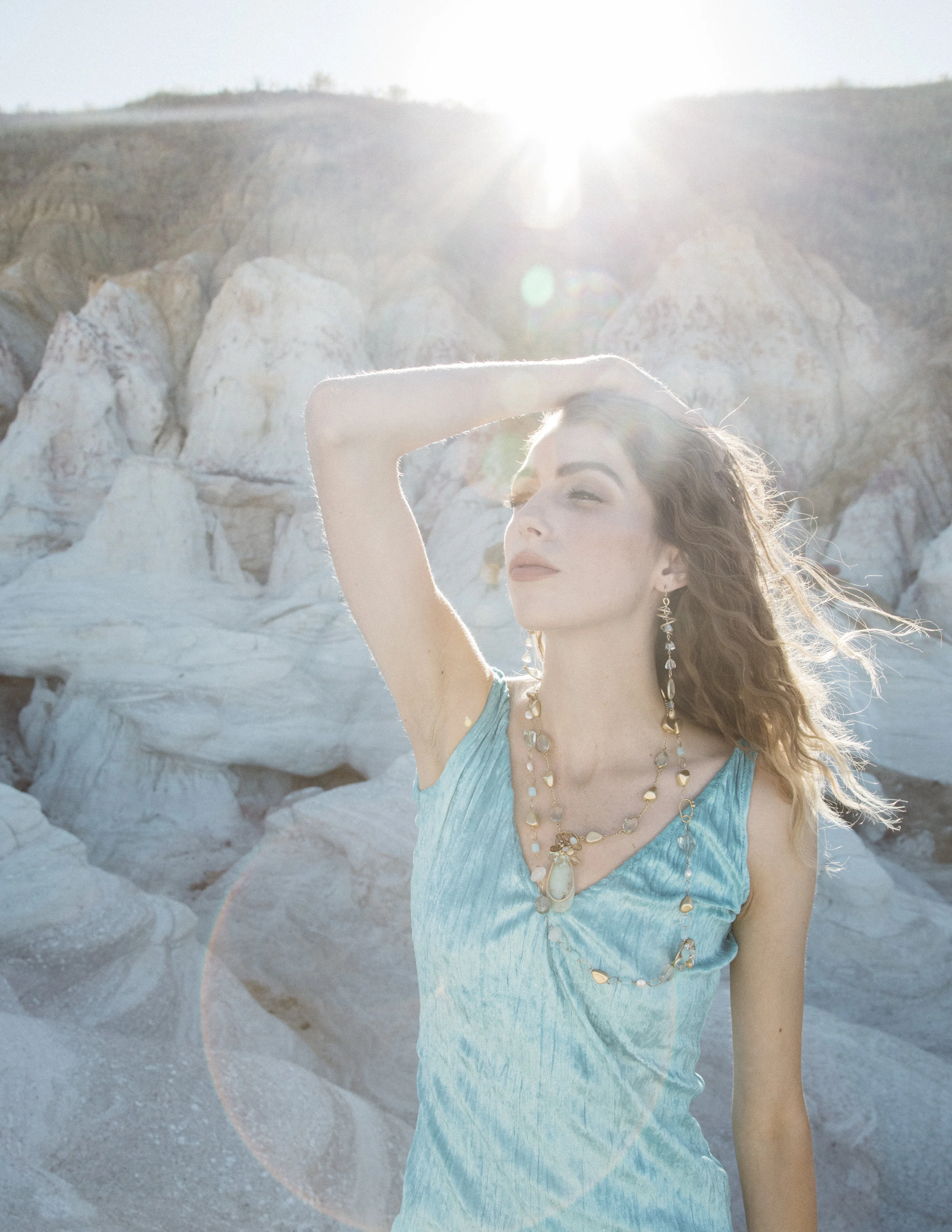 model wearing a peruvian opal pendant and gold necklace