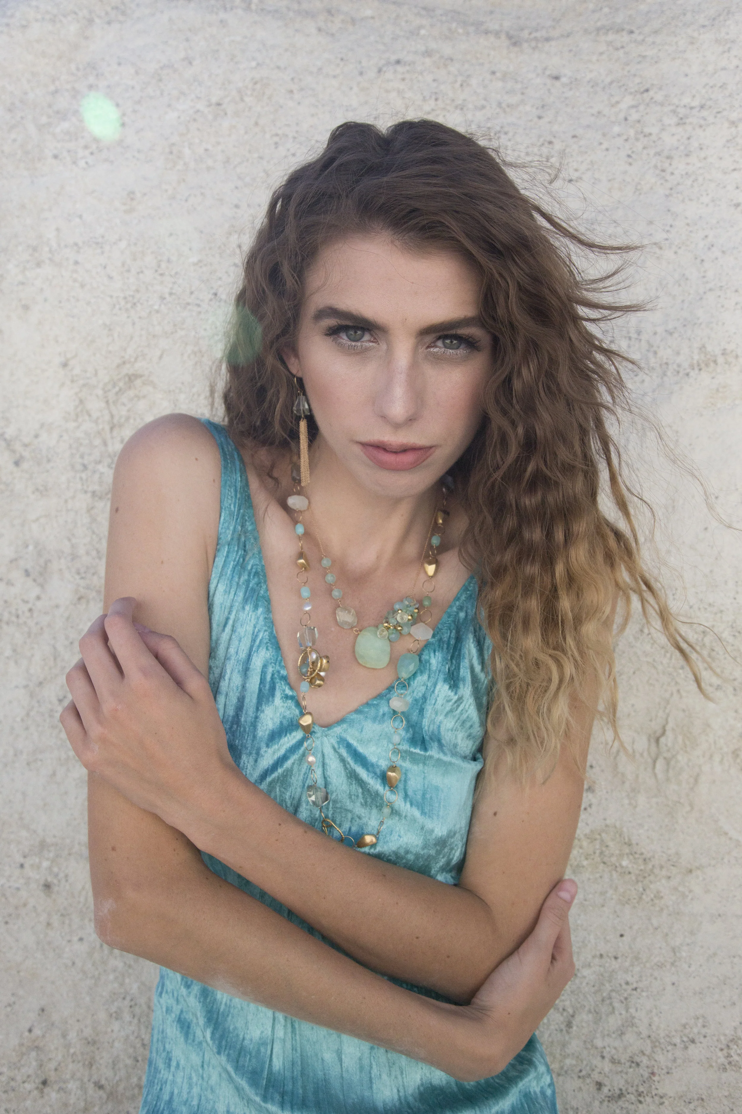 model wearing a peruvian opal and aquamarine nugget with gold necklace