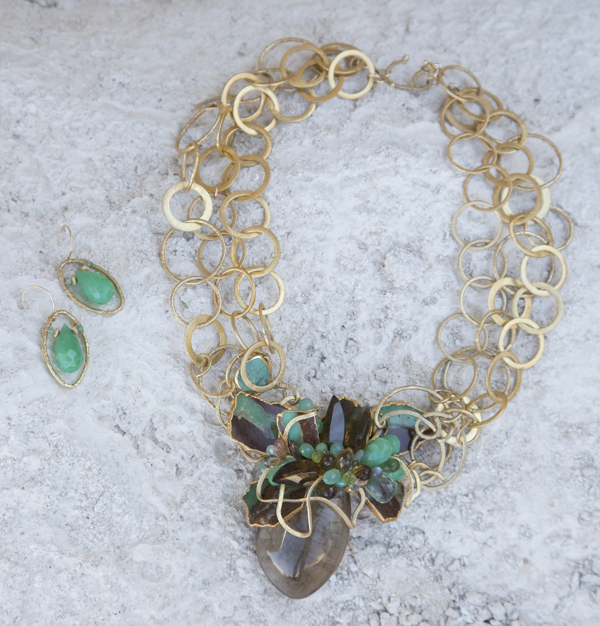 statement necklace with a large smoky topaz pendant with gold link chains