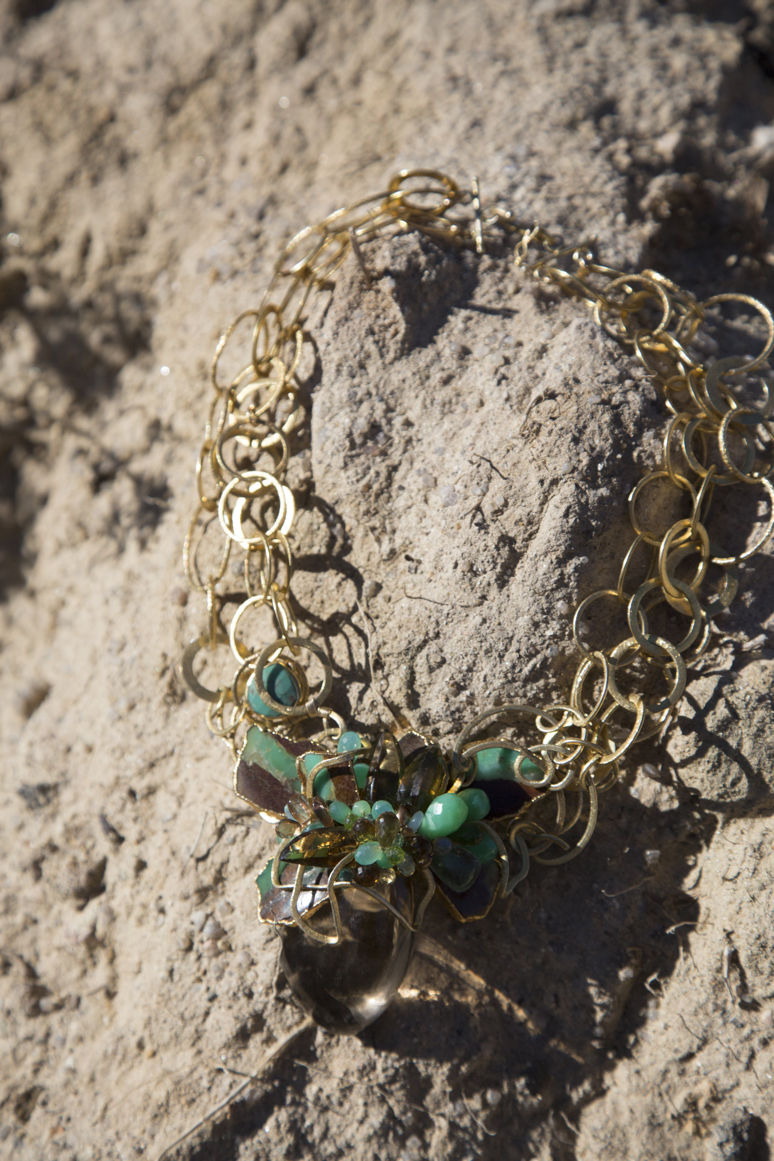 statement necklace with a large smoky topaz pendant with gold link chains