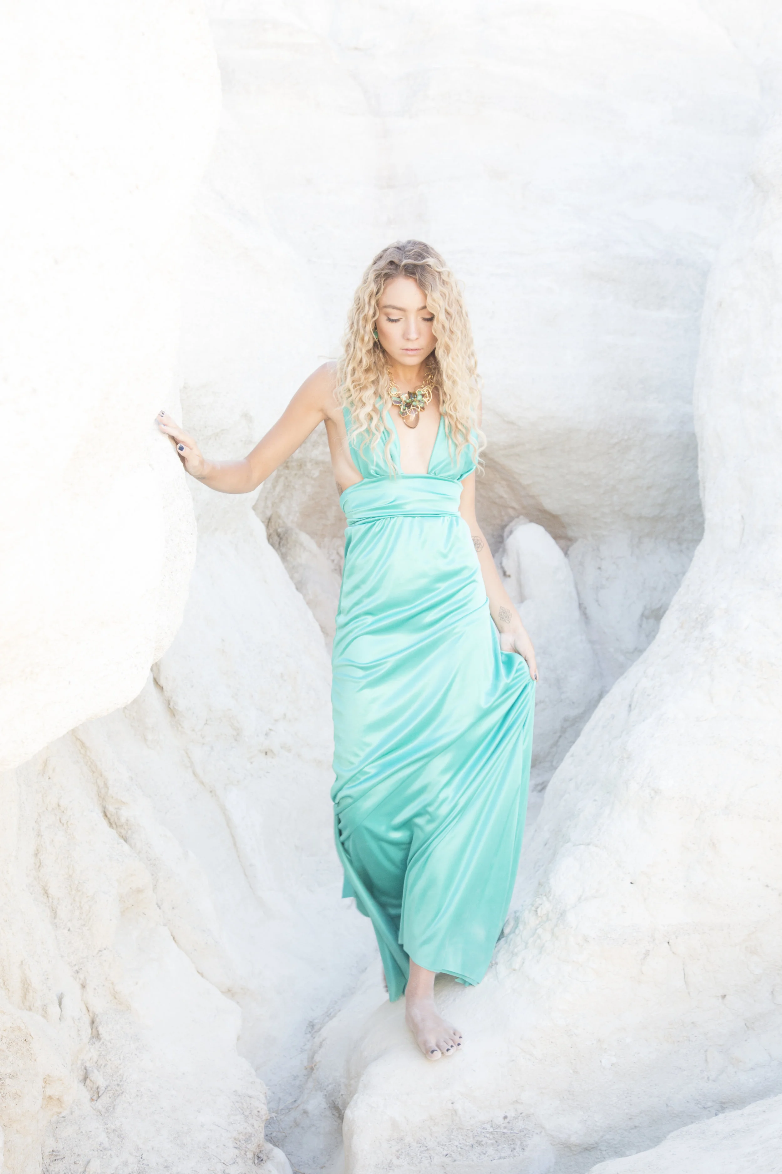 model wearing a statement smoky topaz pendant with gold link necklace