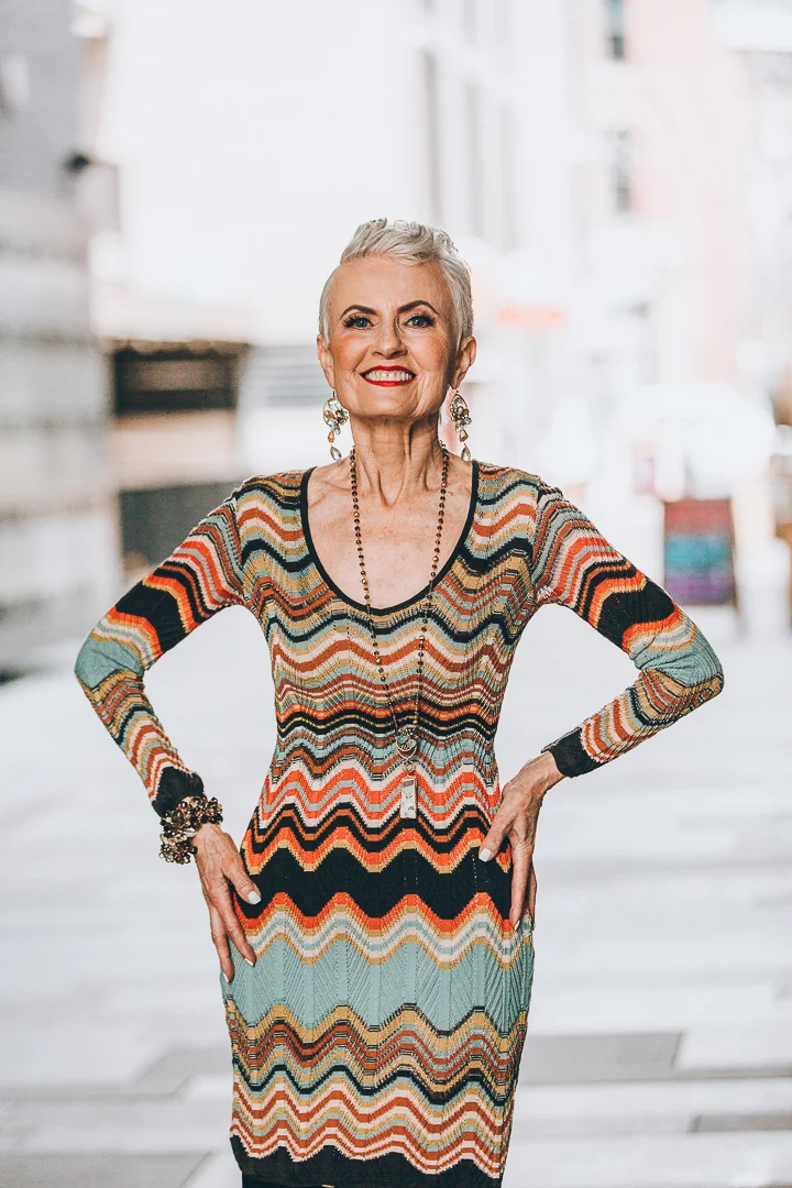 model wearing long gemstone necklace
