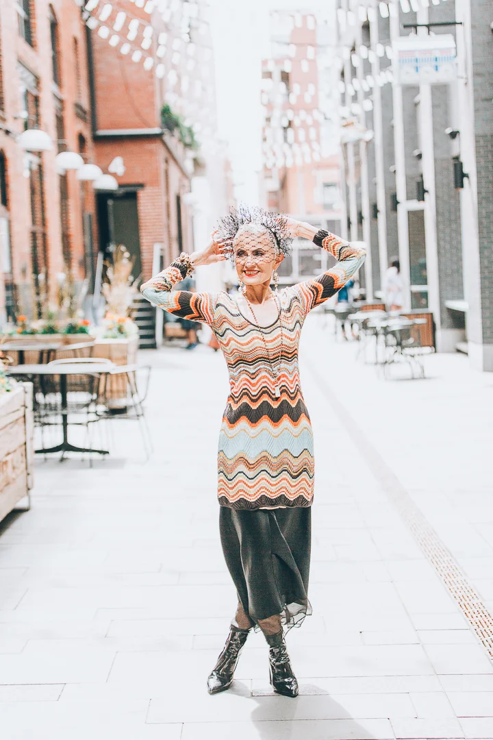 model wearing long gemstone necklace