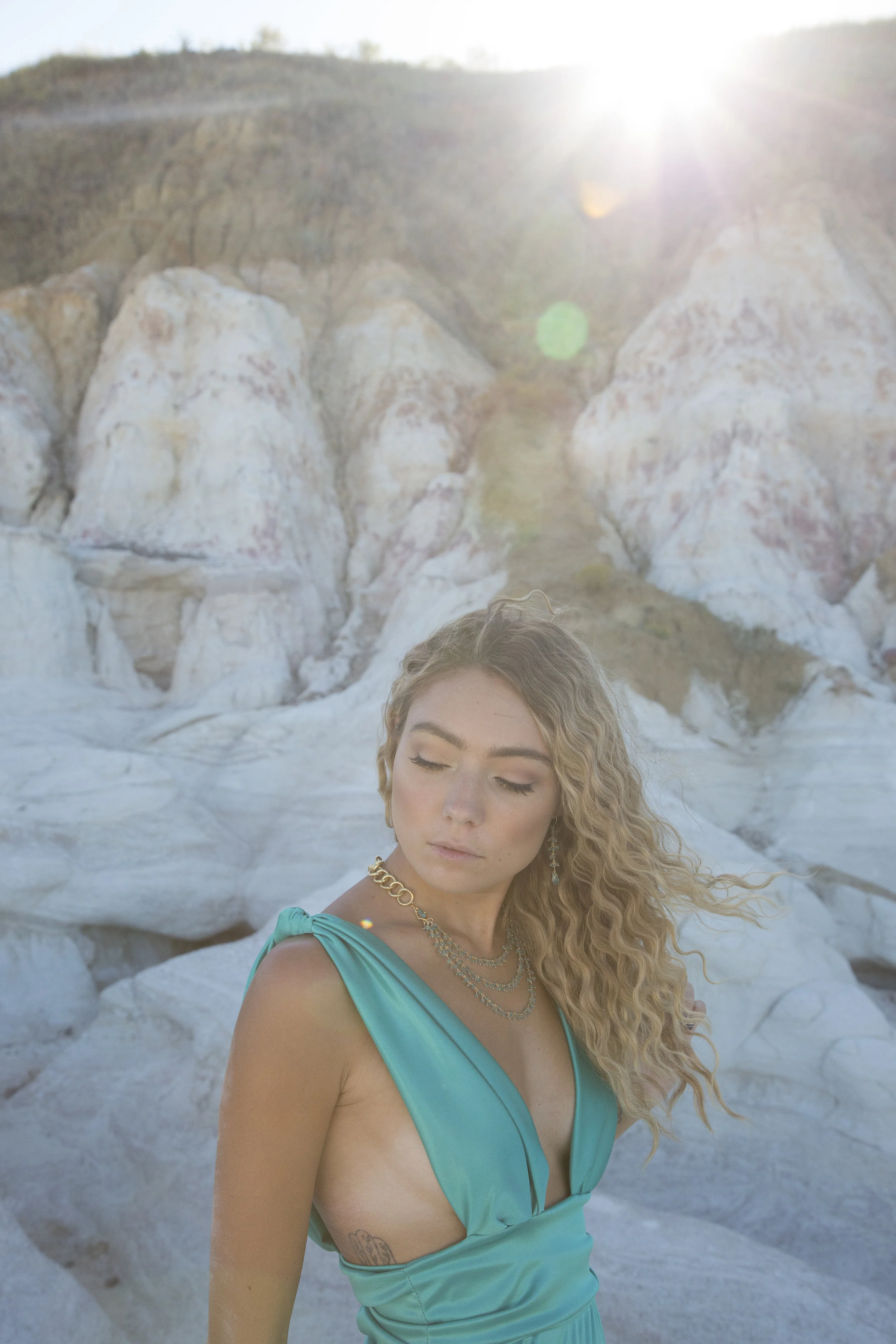 model wearing apatite drop earrings