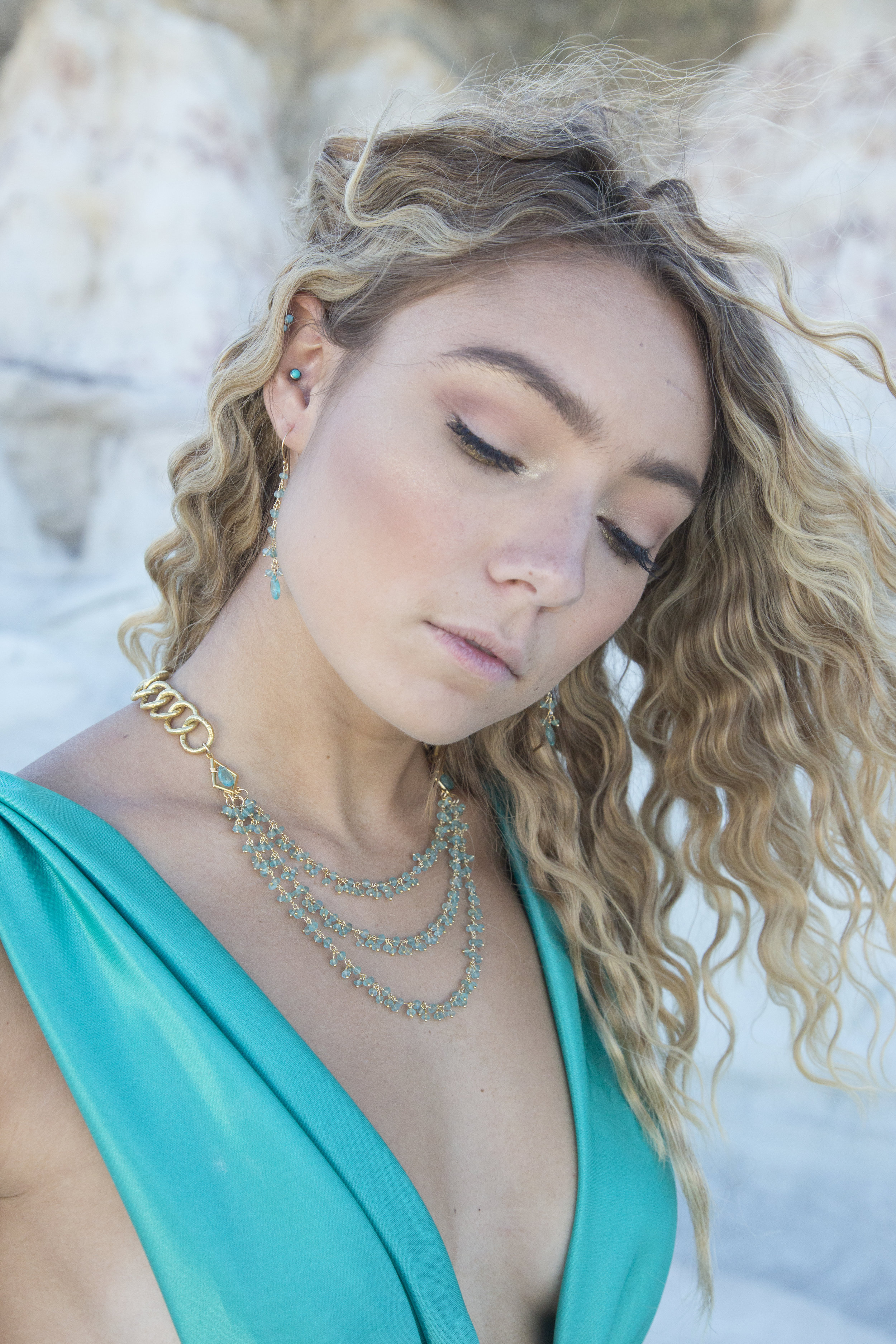 model wearing apatite drop earrings