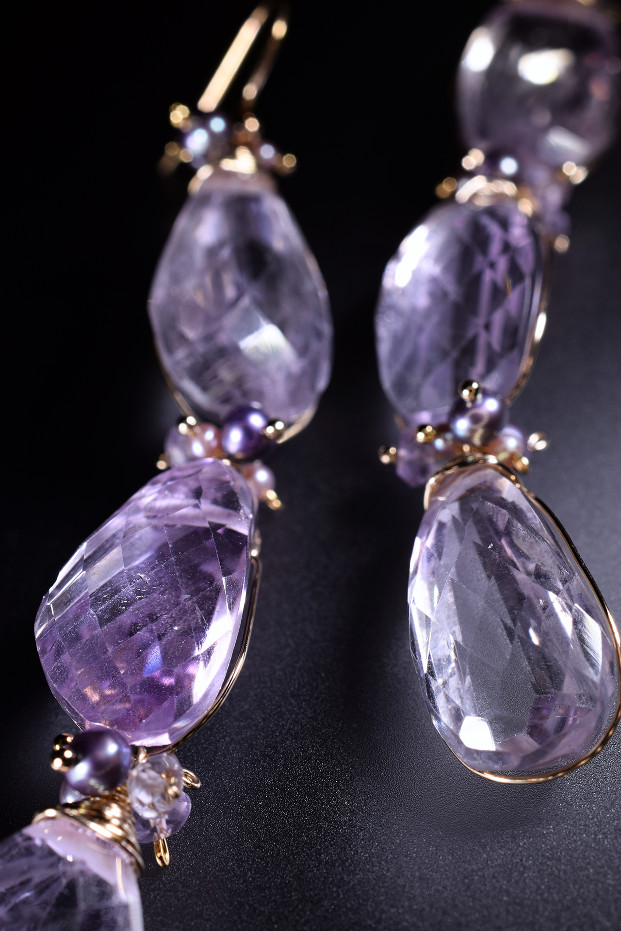 Details of pink amethyst and pearl drop earrings