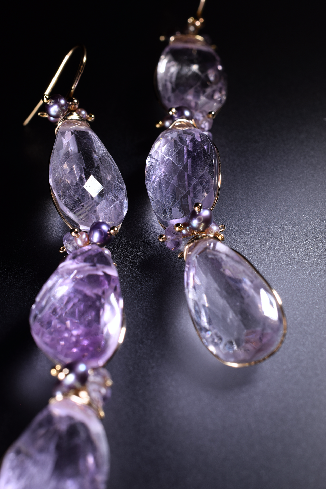Details of pink amethyst and pearl drop earrings