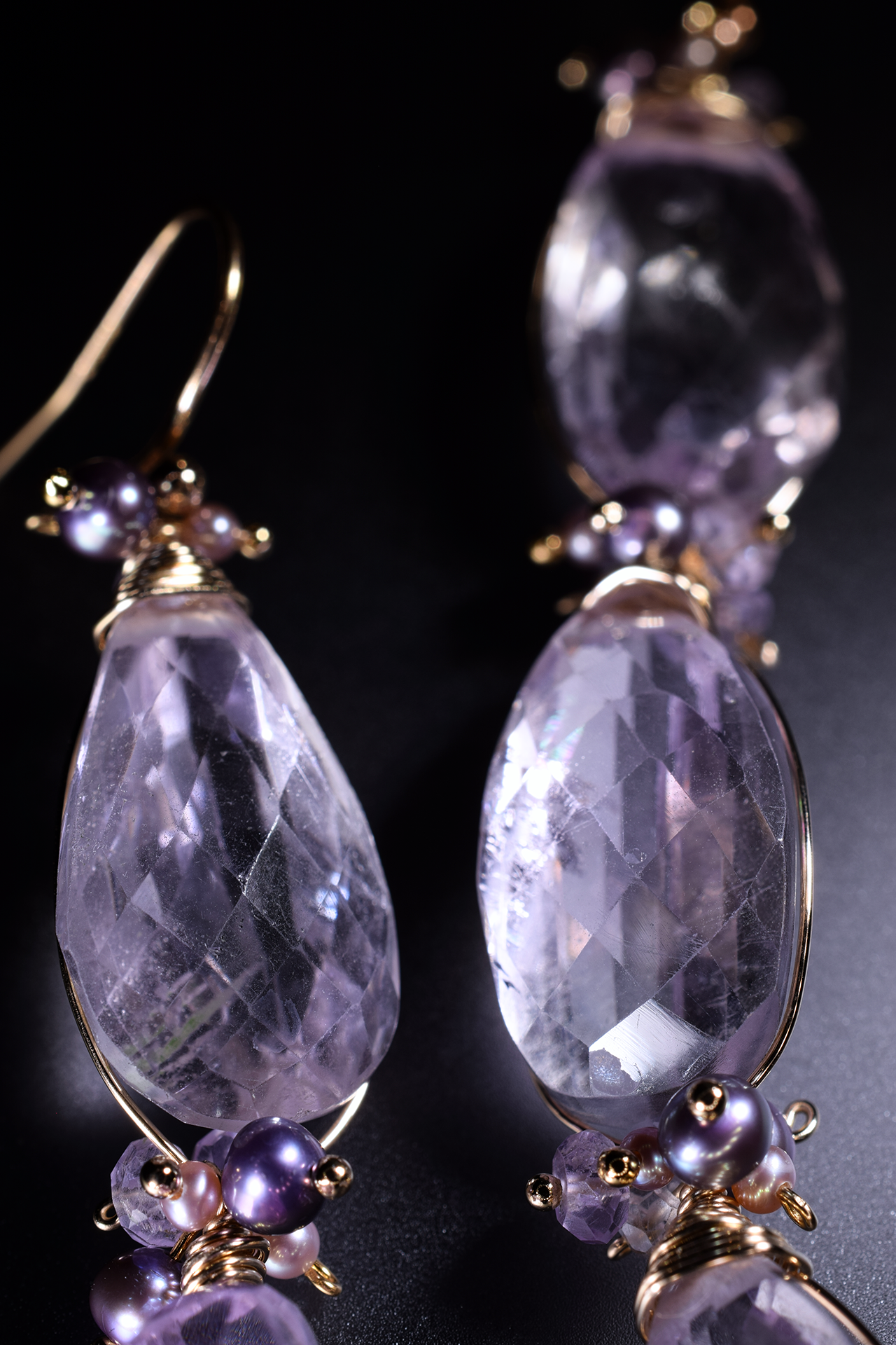Details of pink amethyst and pearl drop earrings