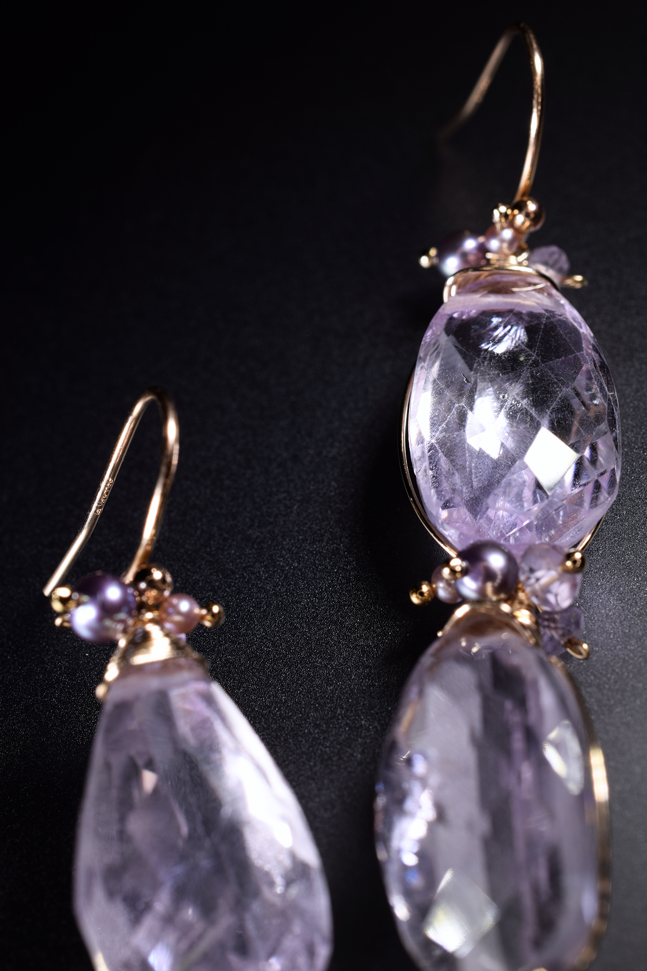 Details of pink amethyst and pearl drop earrings