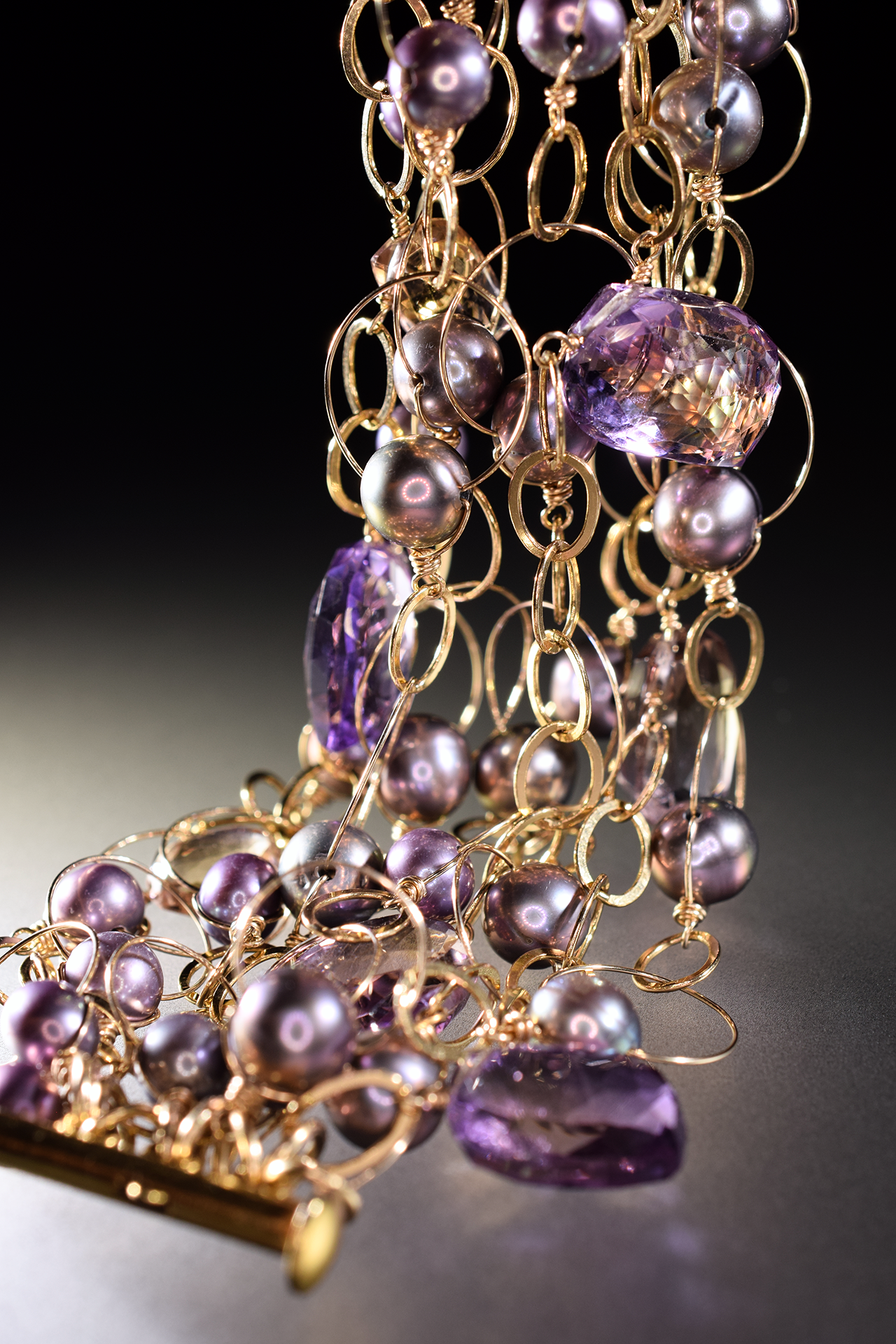 details of ametrine, pearl and gold link statement cuff bracelet