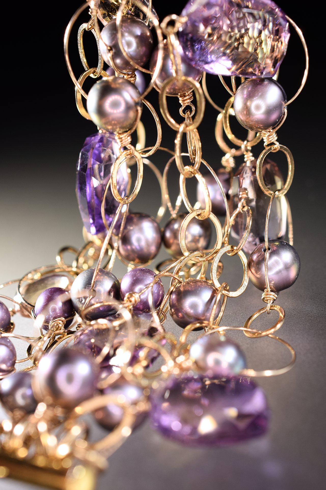 details of ametrine, pearl and gold link statement cuff bracelet