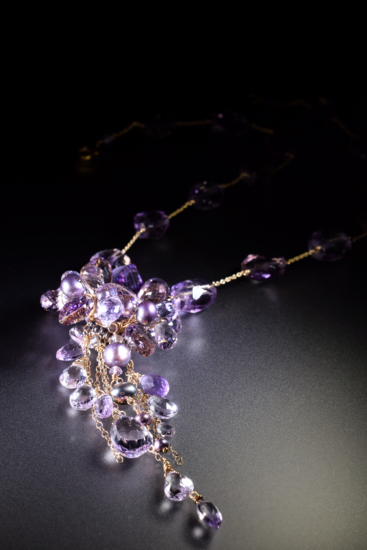 details of a pink amethyst ametrine and pearl multi drop pendant necklace