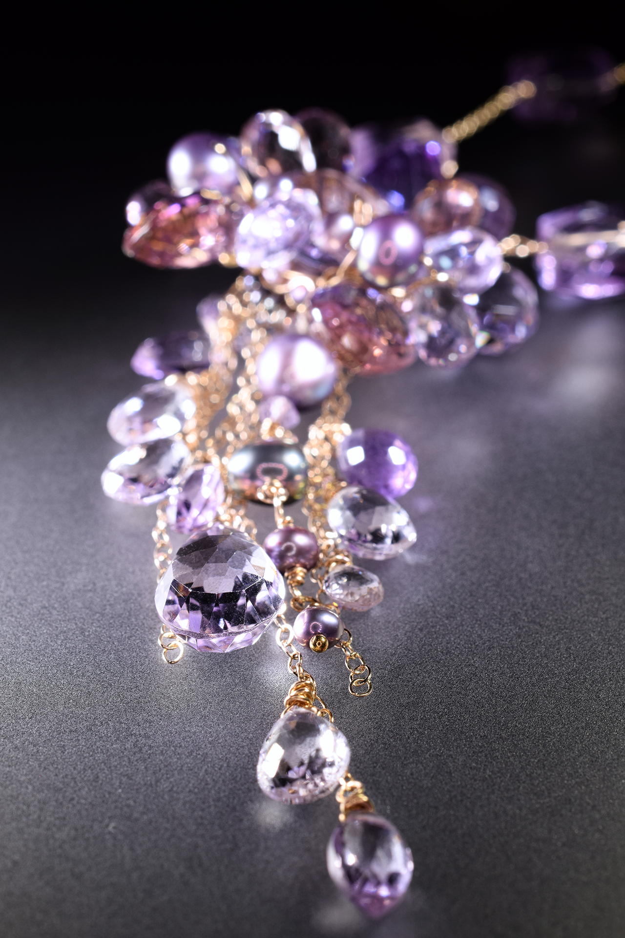 details of a pink amethyst ametrine and pearl multi drop pendant necklace