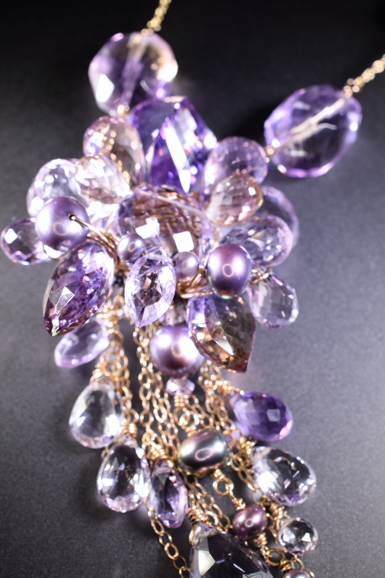 details of a pink amethyst ametrine and pearl multi drop pendant necklace