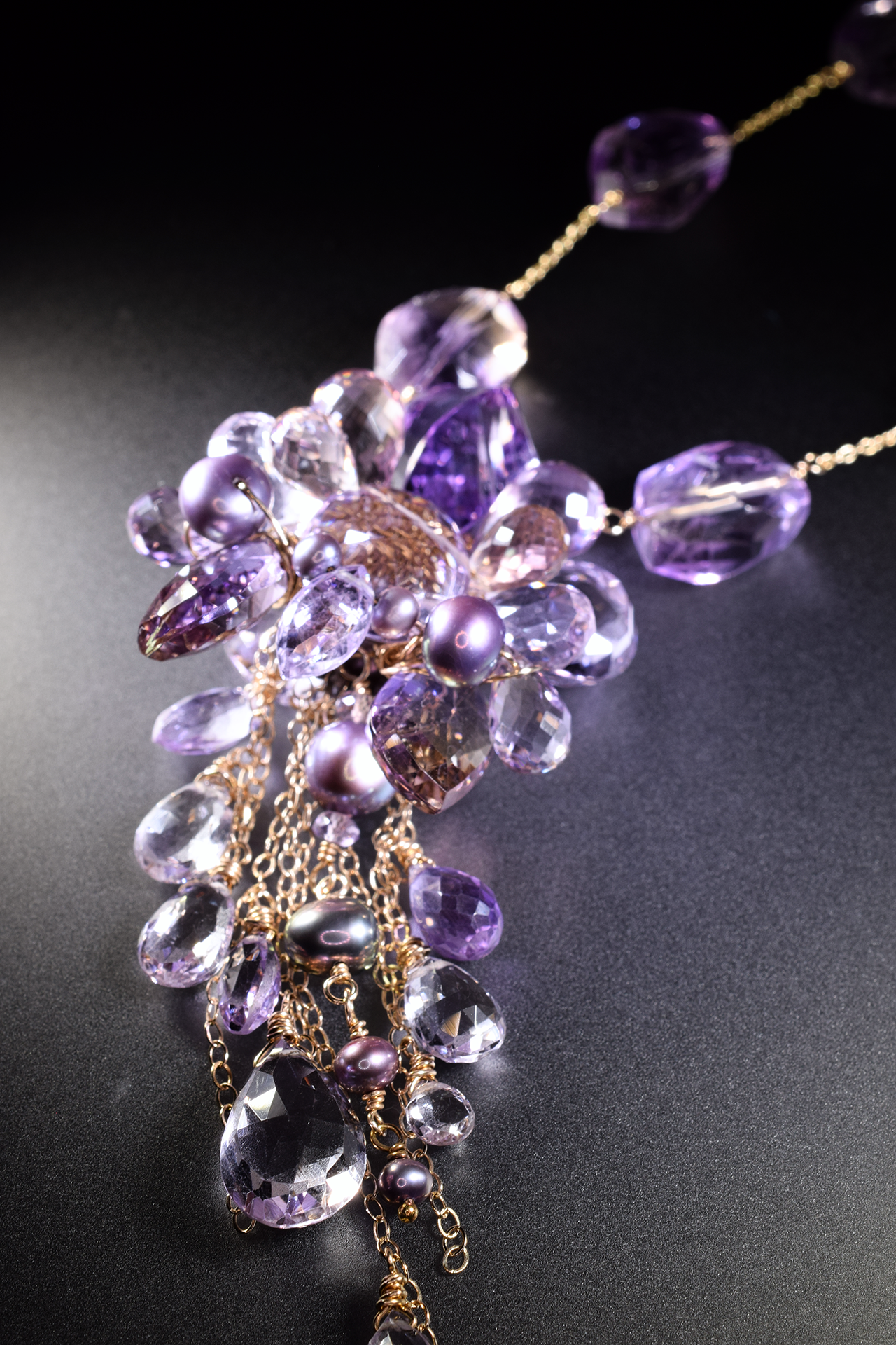 details of a pink amethyst ametrine and pearl multi drop pendant necklace