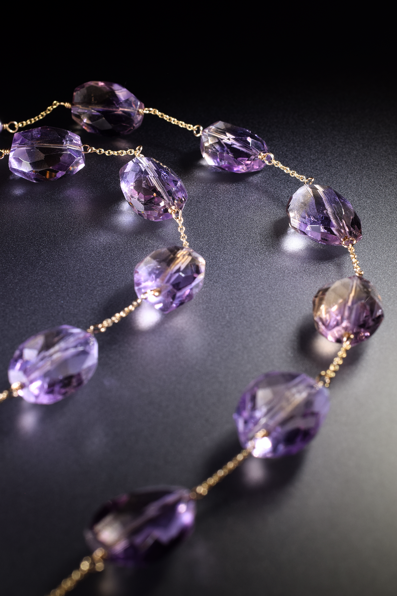 details of a pink amethyst ametrine and pearl multi drop pendant necklace