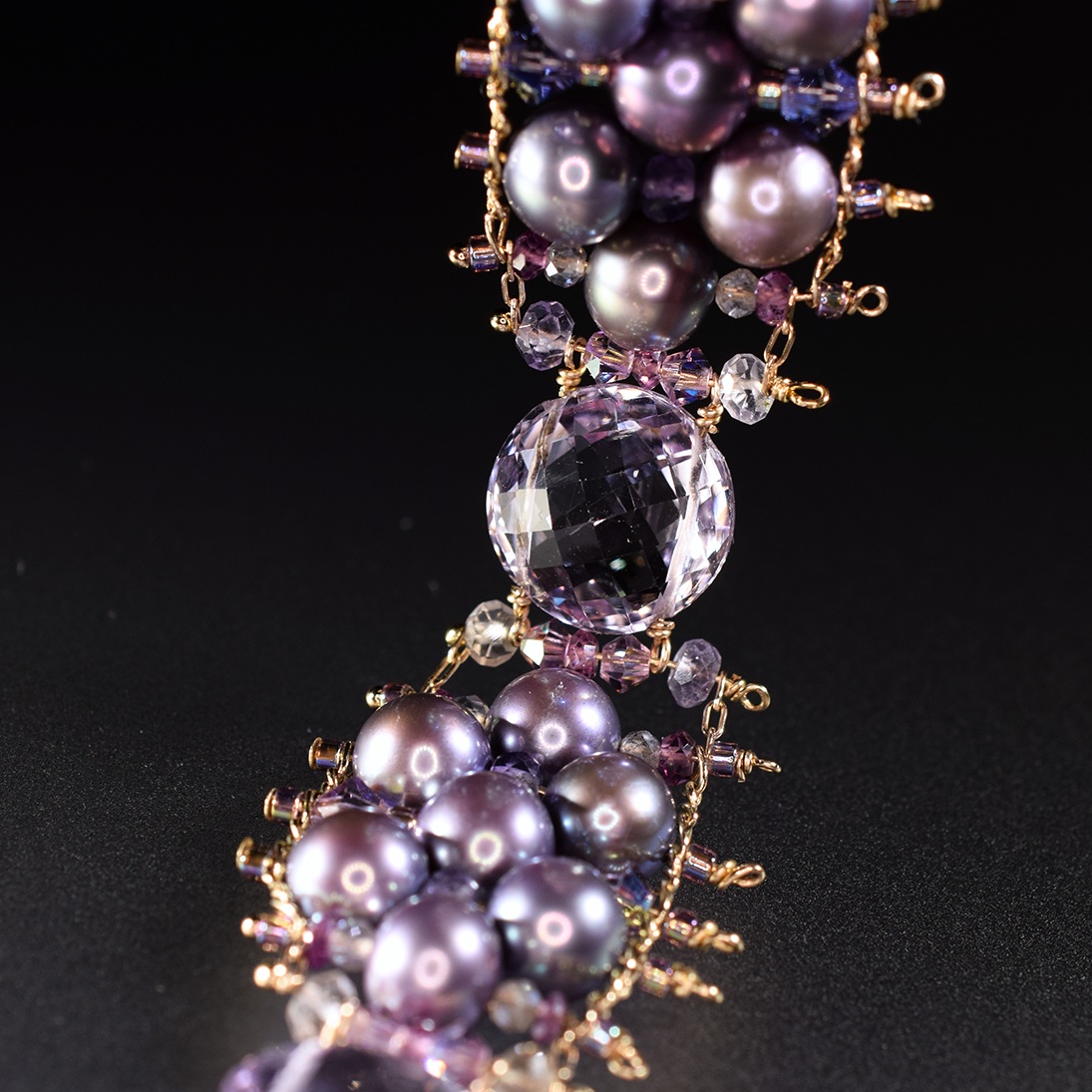 details of a pearl and pink amethyst bracelet